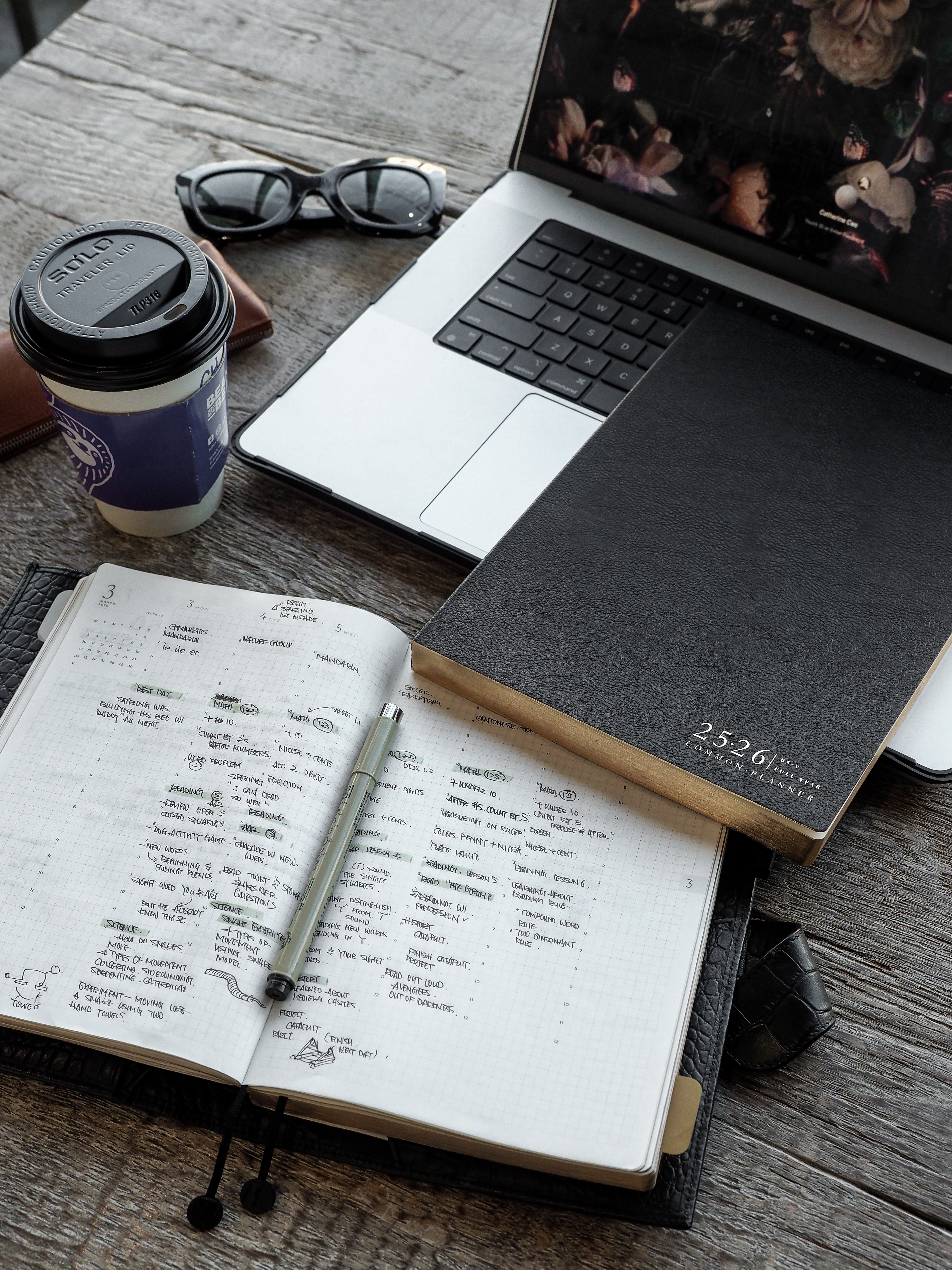Open 2025-2026 academic planner and calendar notebook set showing detailed scheduling grids for students, perfect for yearly organization.
