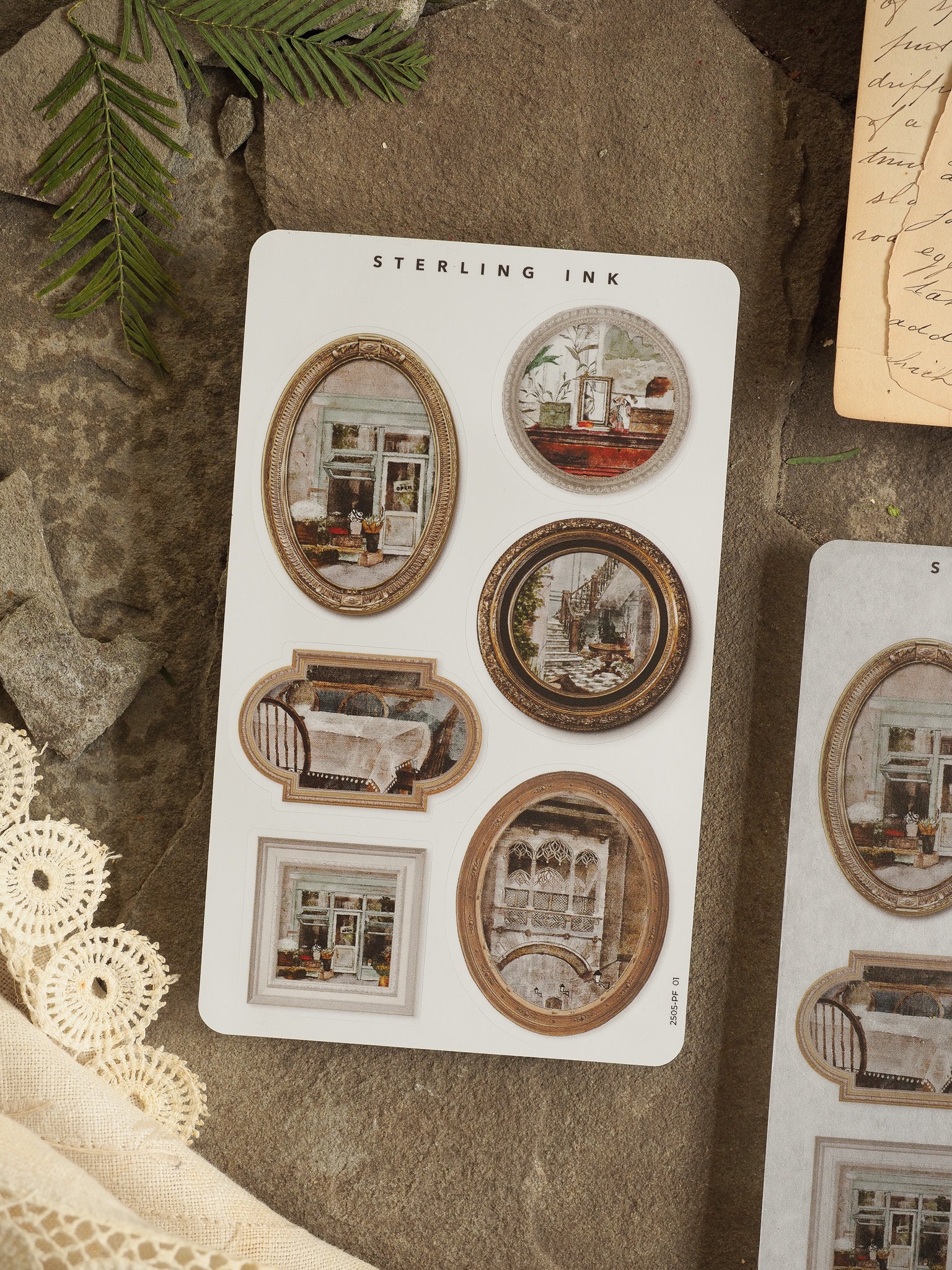 Collection of antique-style die-cut craft stickers on a white card, featuring various sepia-toned scenes of framed windows and nostalgic vintage interior rooms.