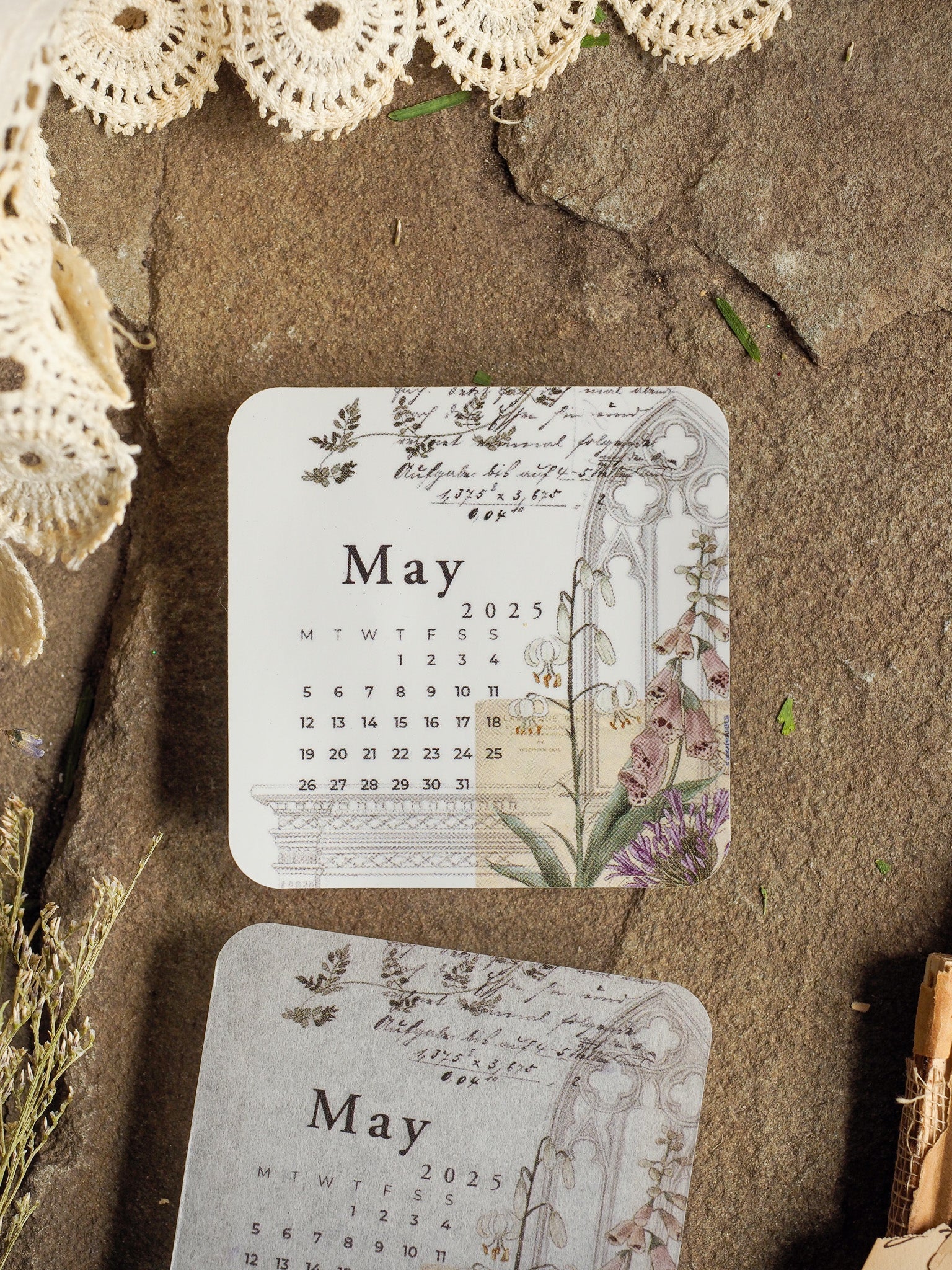 Vintage May 2025 calendar planner sticker featuring an elegant botanical design, surrounded by detailed purple spring florals and greenery for journaling.