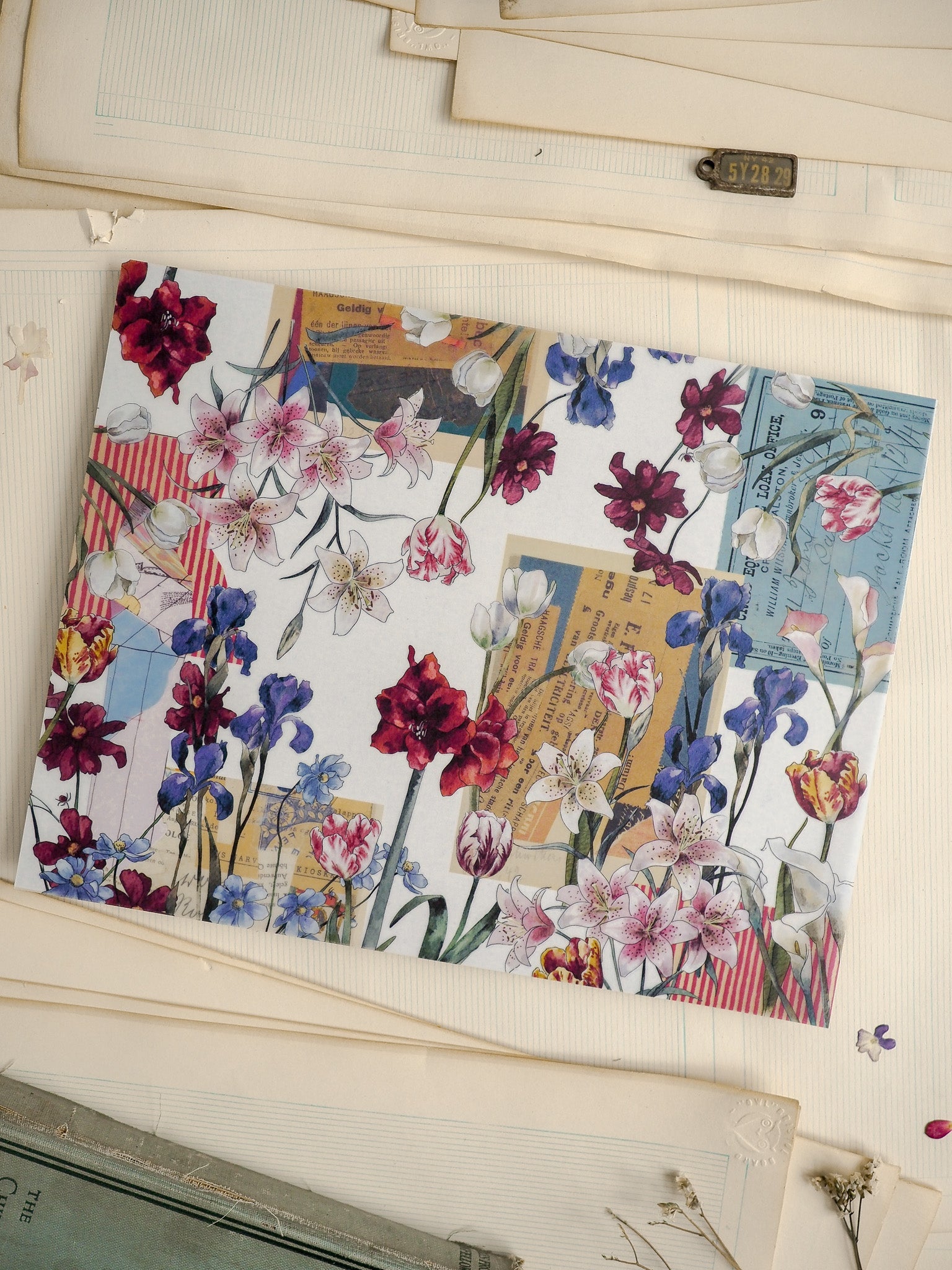 Vibrant collage pattern featuring pink, blue, and red flowers intermingled with vintage ticket stubs and distressed scrapbook ephemera.