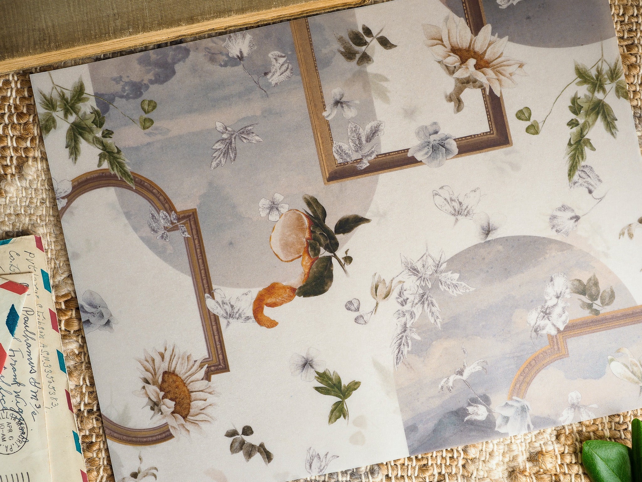 Muted botanical planner design featuring painted sunflowers, lush greenery, and delicate white foliage within ornate antique gold picture frames.