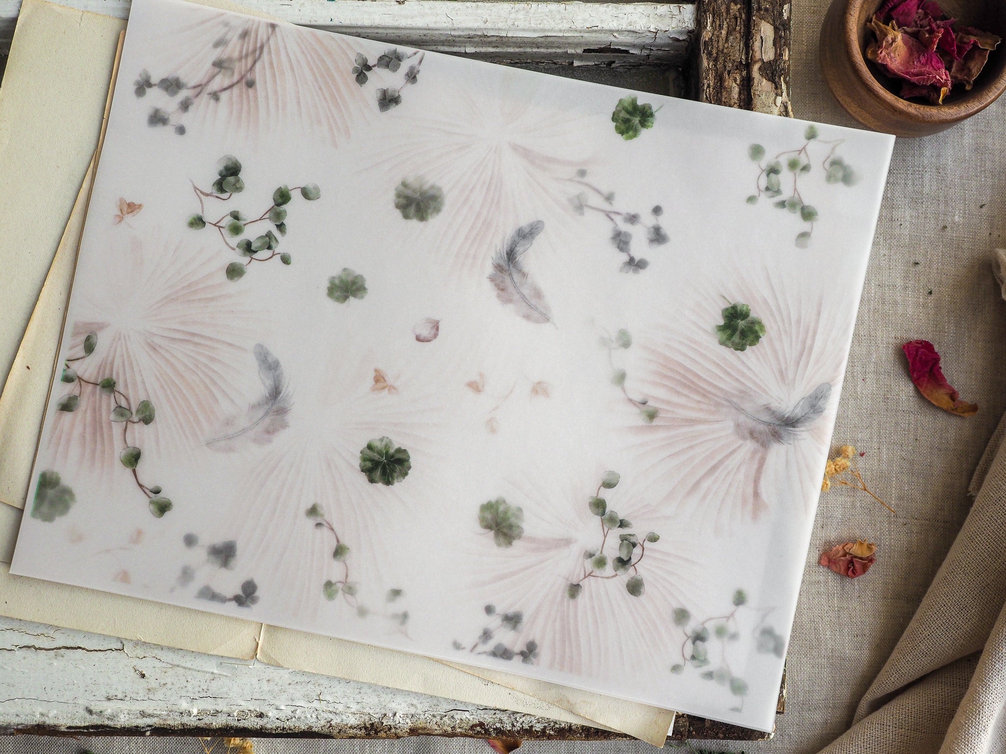 Delicate, seasonal pattern combining blush palm fans with scattered sage green foliage and muted gray feathers, evoking an autumn aesthetic.