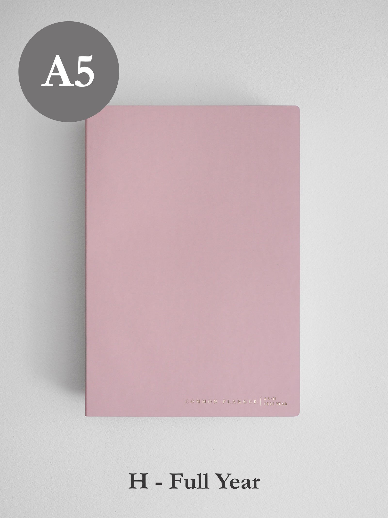 Minimalist solid blush pink A5 horizontal planner cover, designed for undated full year planning and featuring a clean, elegant aesthetic.