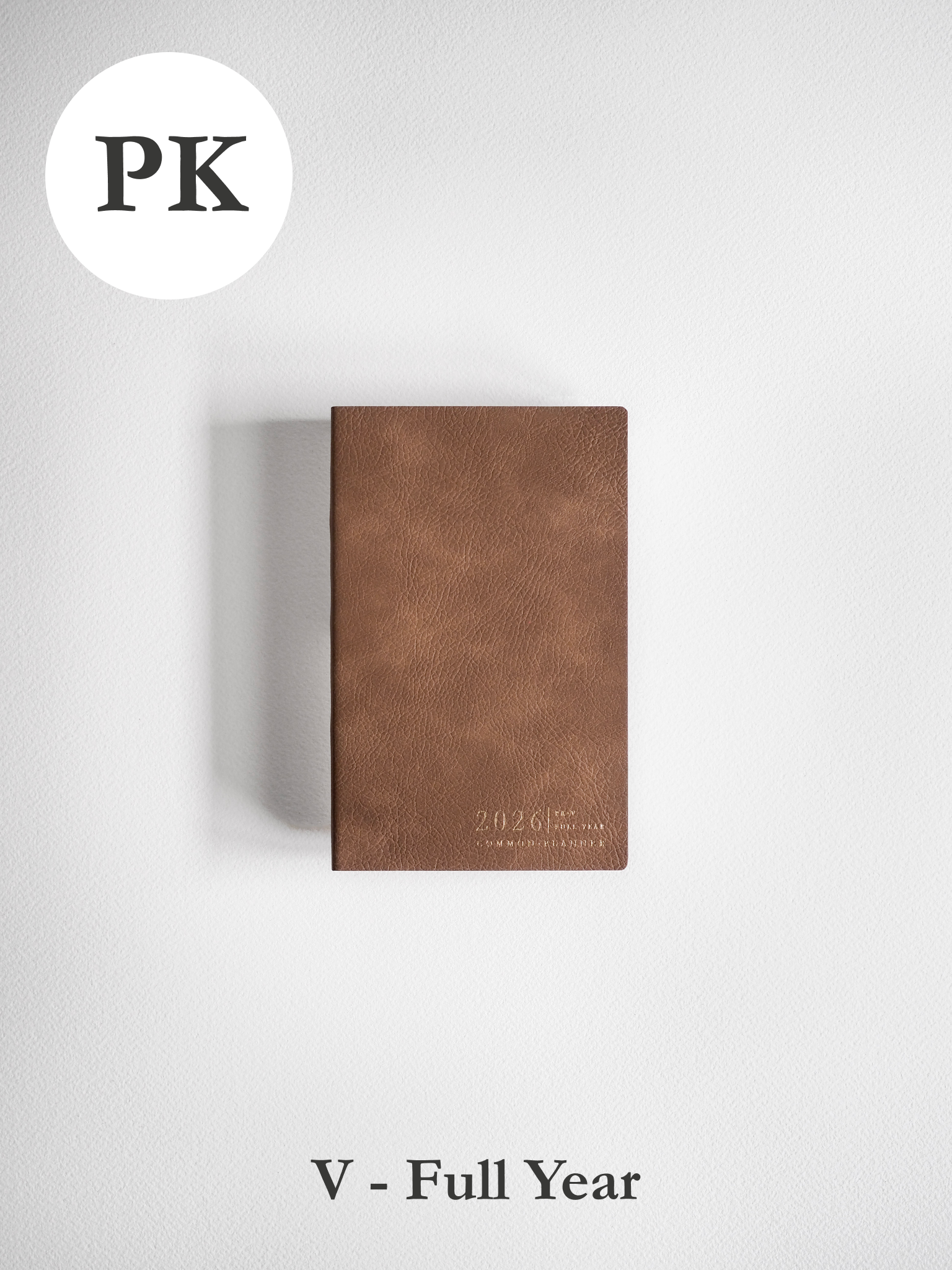 Portable, vertical 2026 planner crafted from deep brown faux leather, featuring a clean and elegant embossed design on the front cover.