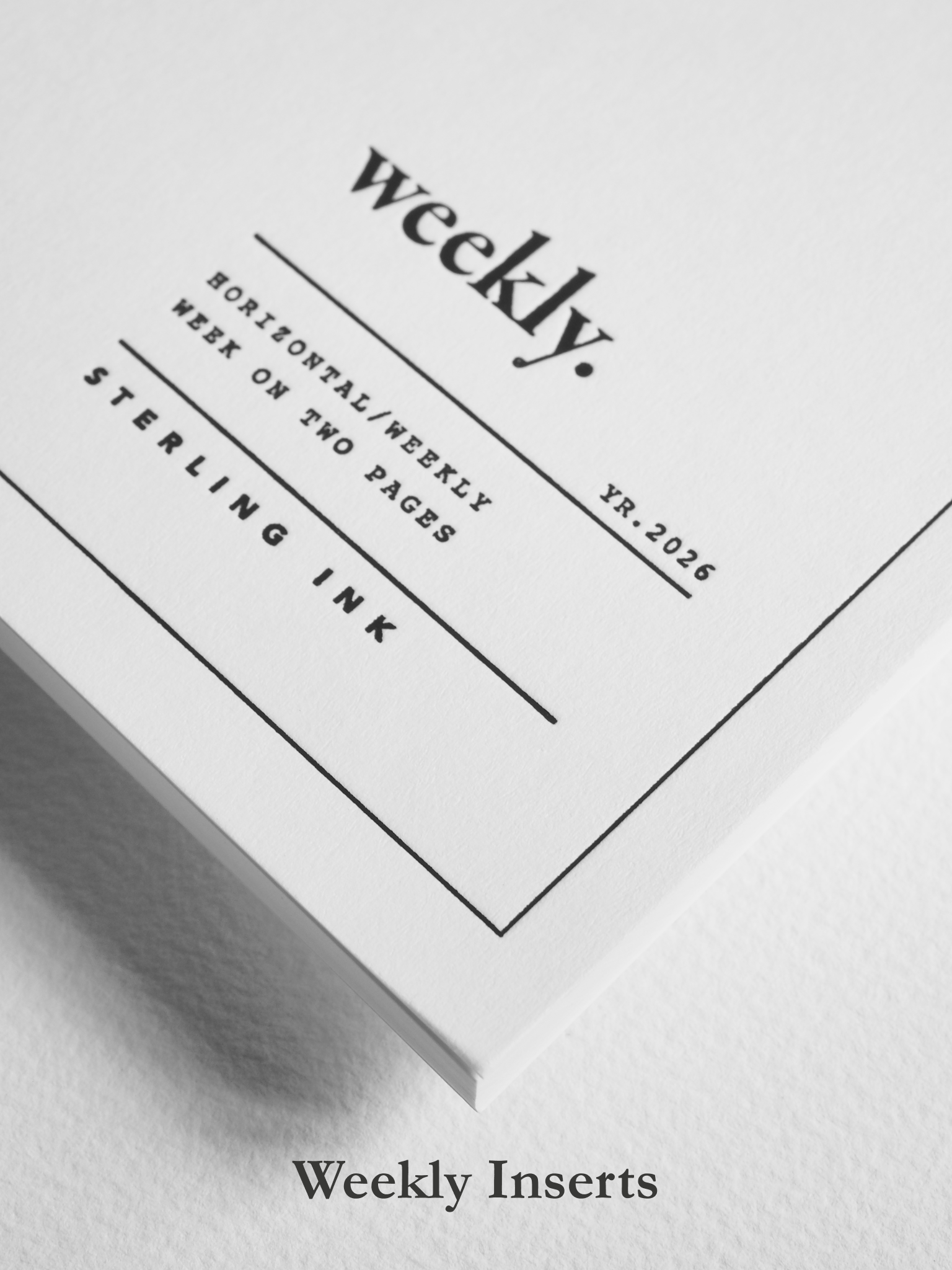 Minimalist white weekly planner insert featuring black, elegant typography, the prominent title "weekly.", and structured branding for 2026 planning.