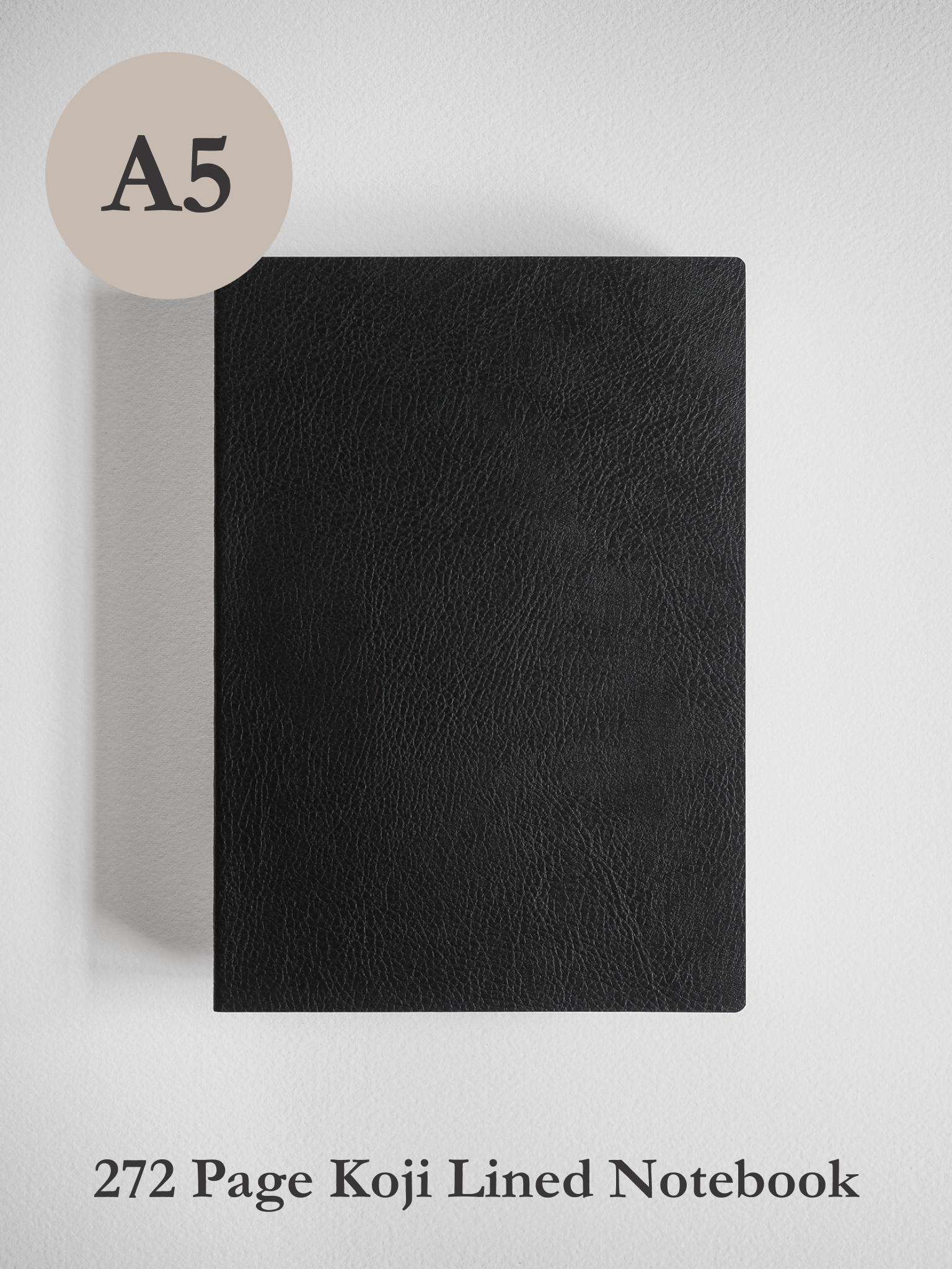 Sleek, solid black A5 notebook with a minimalist, plain cover, ideal for journaling or writing notes on Koji paper.