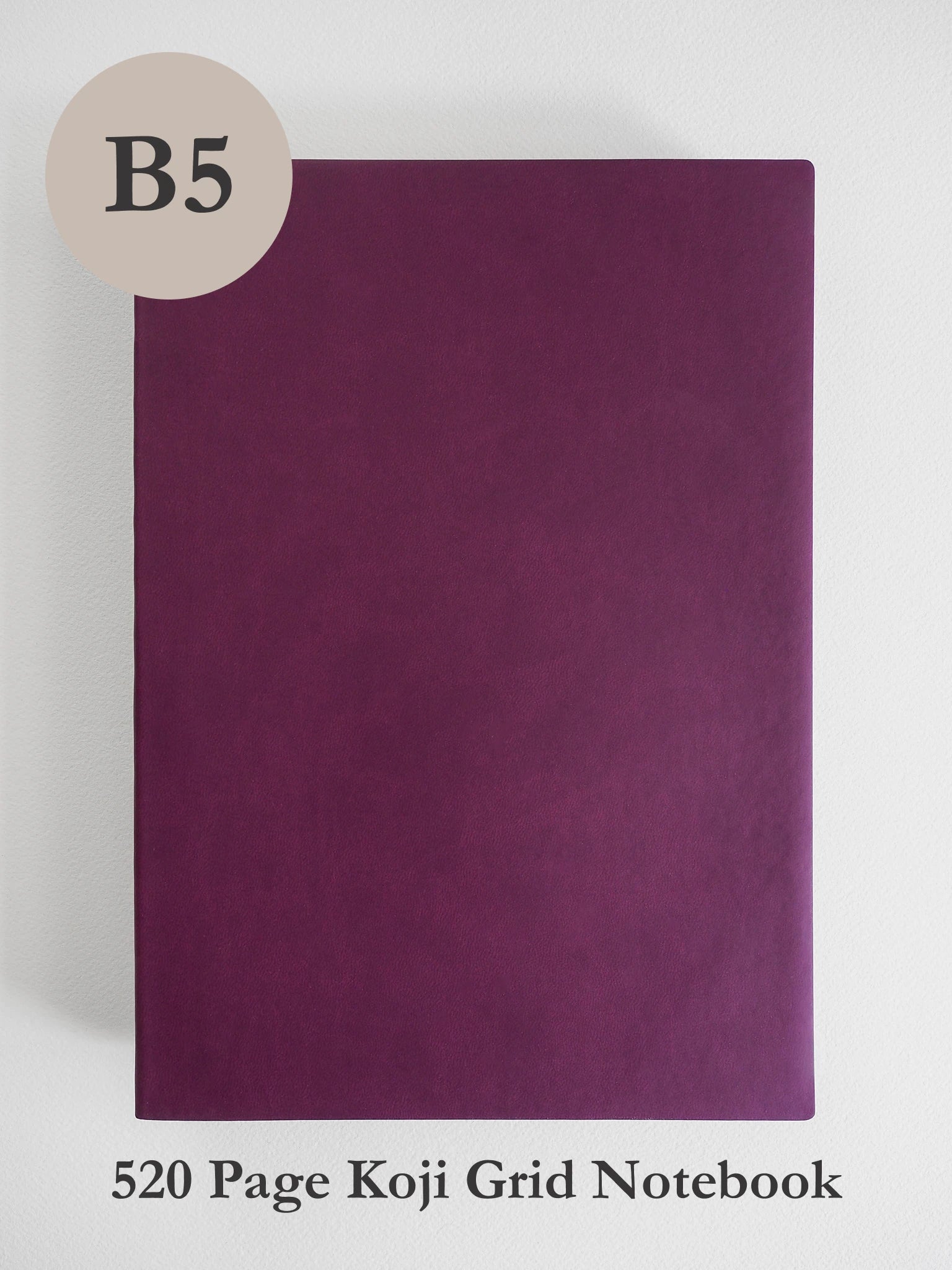 A dark purple B5 size koji grid notebook shown against a light gray background, with a beige circle label reading 'B5' in the top left and text at the bottom reading '520 Page Koji Grid Notebook'.
#Color_Mulberry