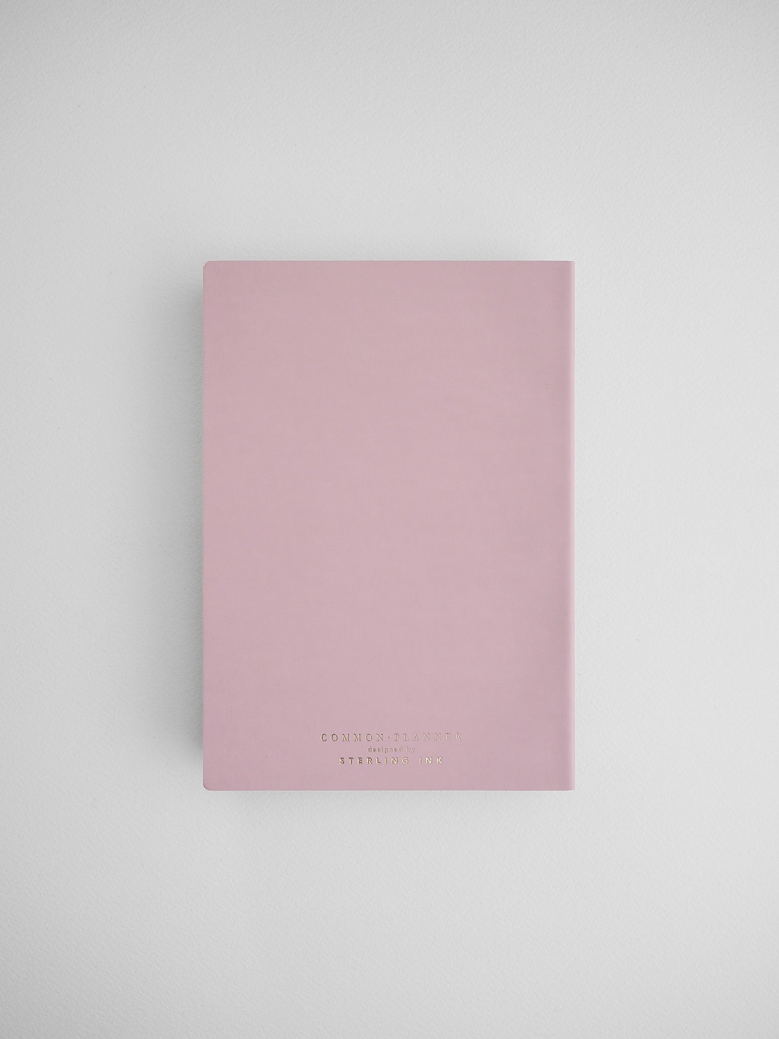 Pale blush pink B6 planner cover branded with "COMMON PLANNER" and "STERLING INK," ideal for undated journaling and full year planning.
