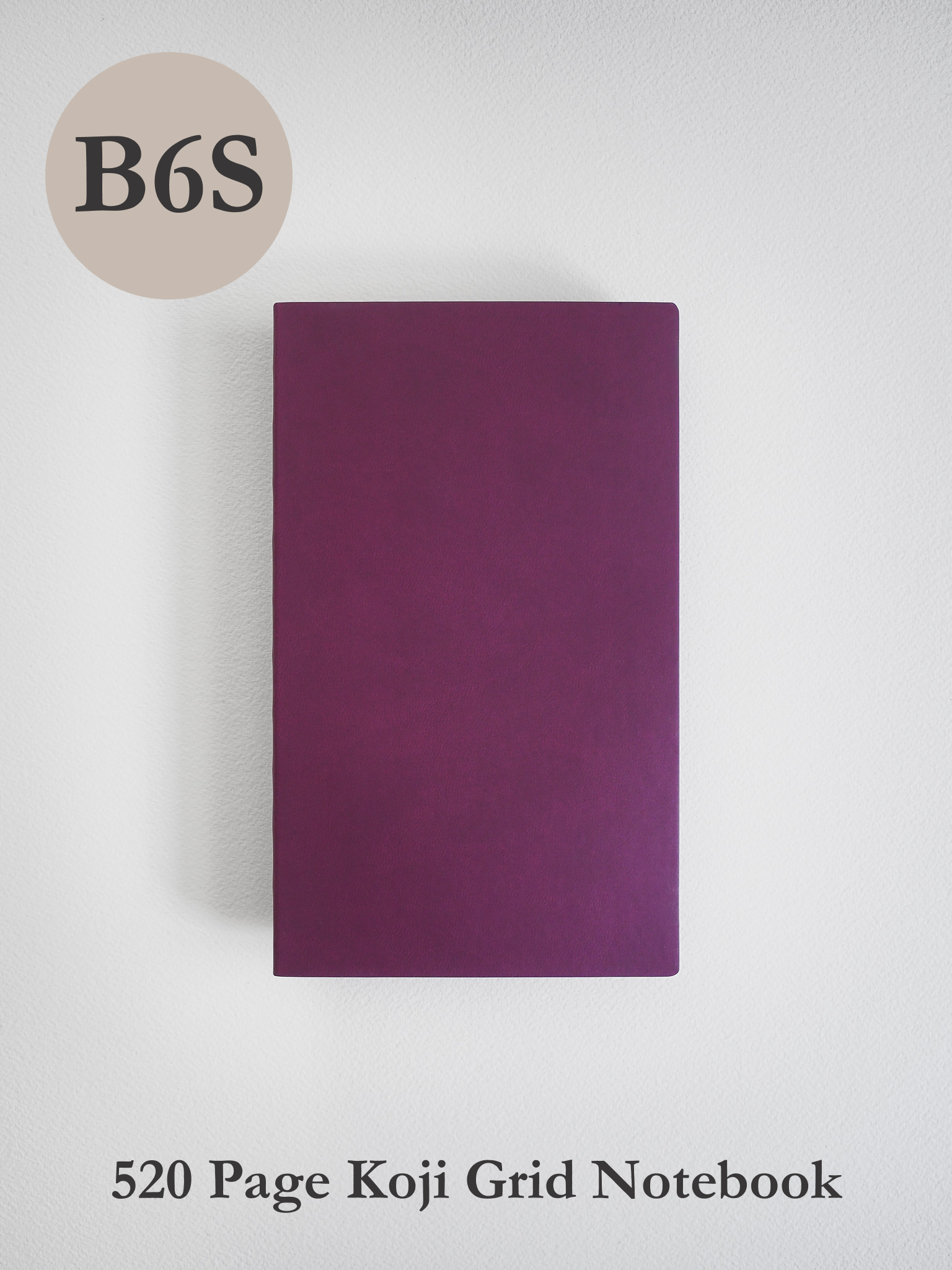 Solid deep plum B6 notebook with a smooth, matte cover, designed for 520 pages of structured grid journaling.