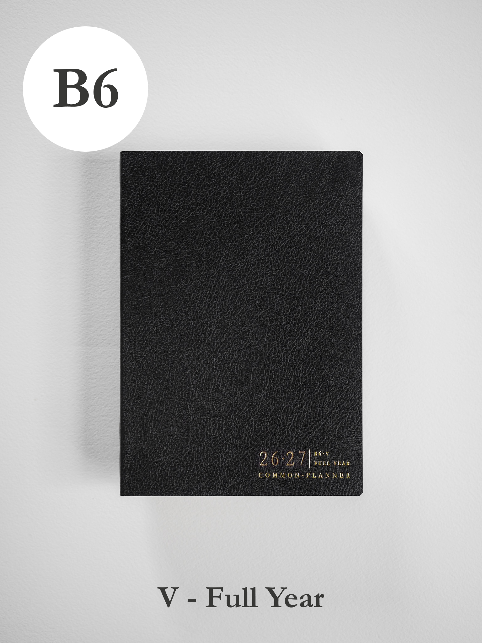 Minimalist black B6 academic planner cover, textured like faux leather, featuring debossed 2026-2027 details for the full year.