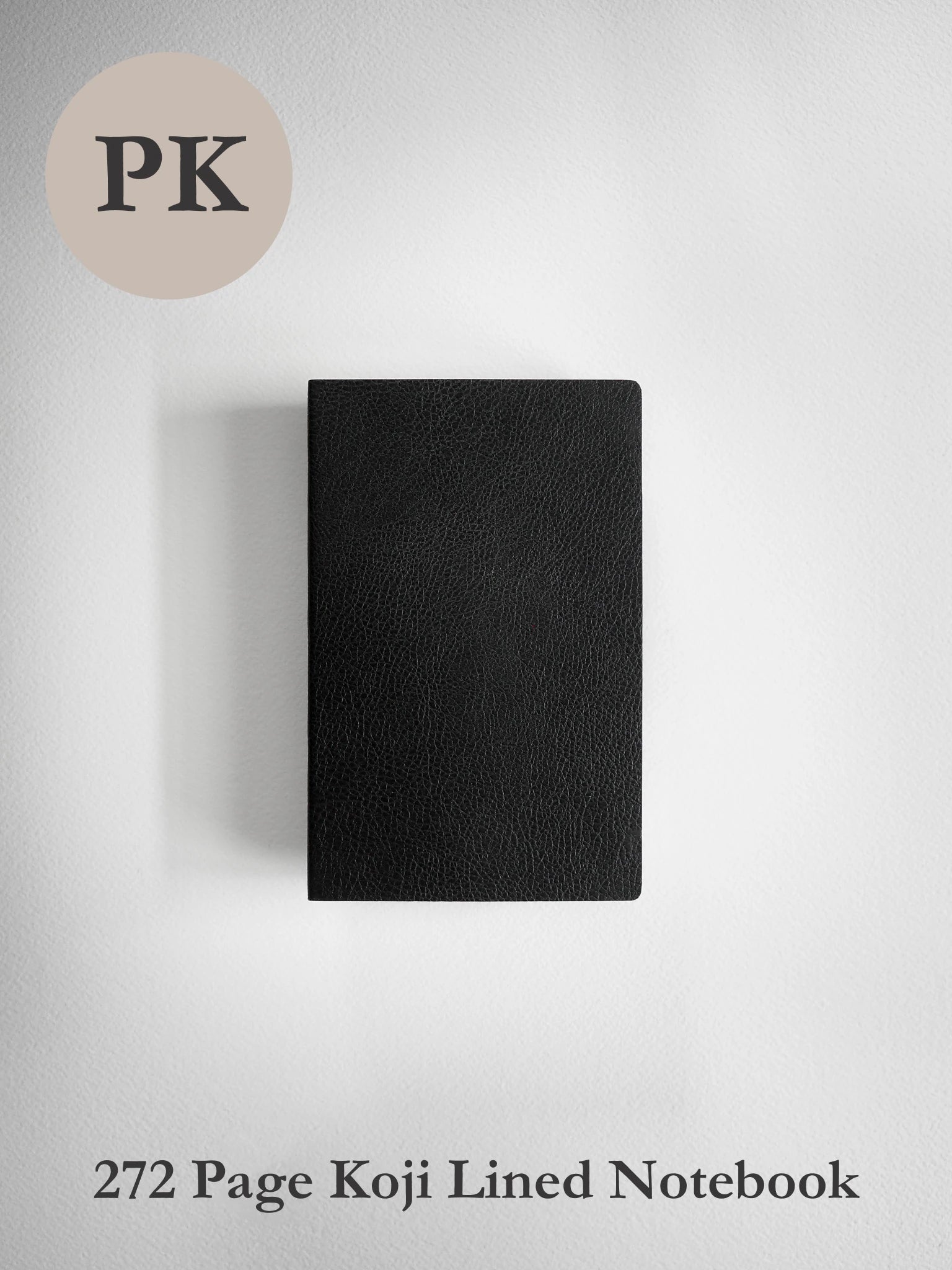A black textured notebook centered on a light gray background, with a beige circle containing the letters 'PK' in the top left and the text '272 Page Koji Lined Notebook' at the bottom.
#Color_Onyx