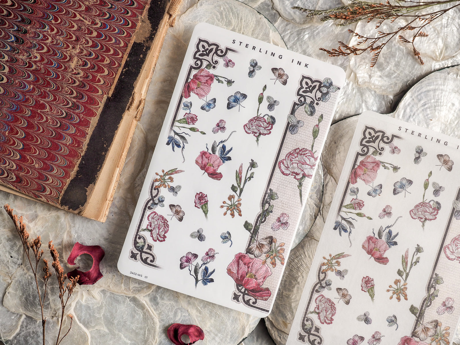 Elegant washi strip stickers adorned with a soft botanical print of pastel pink and blue roses, vines, and delicate foliage.