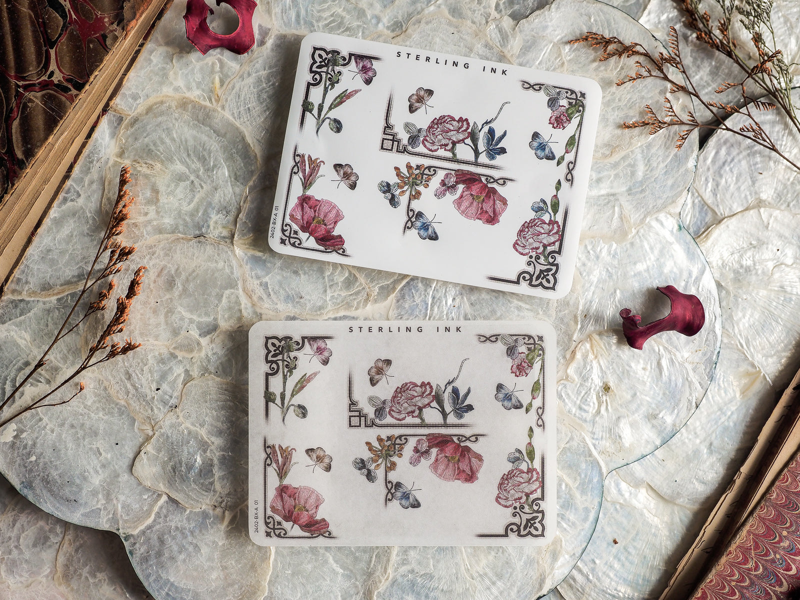 Three elegant corner stickers featuring detailed botanical illustrations of blush roses, delicate butterflies, and vintage floral corner motifs.