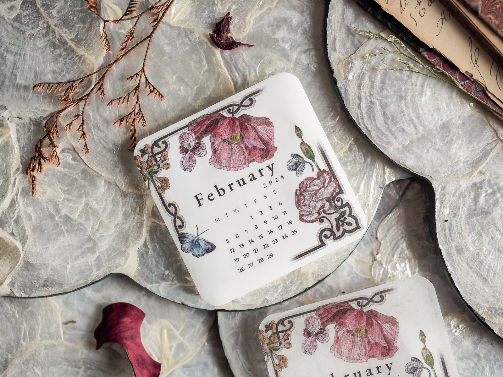 Ornate monthly calendar sticker for February 2024, featuring a romantic floral design framed by detailed pink and deep red watercolor roses and elegant foliage.