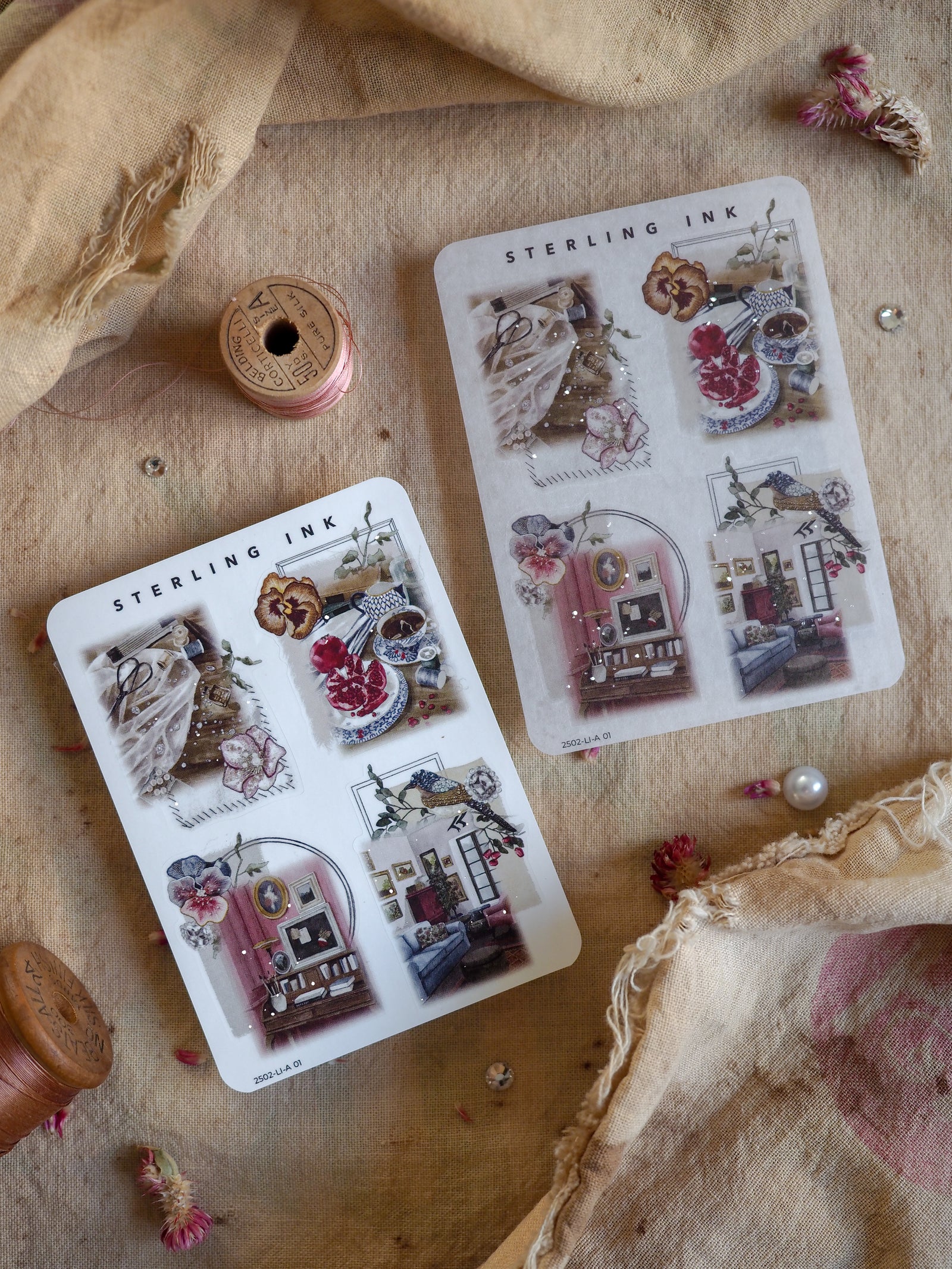 Vintage sticker sheets featuring elegant, detailed illustrations of distressed interiors, accented with delicate silver foil accents for crafting.