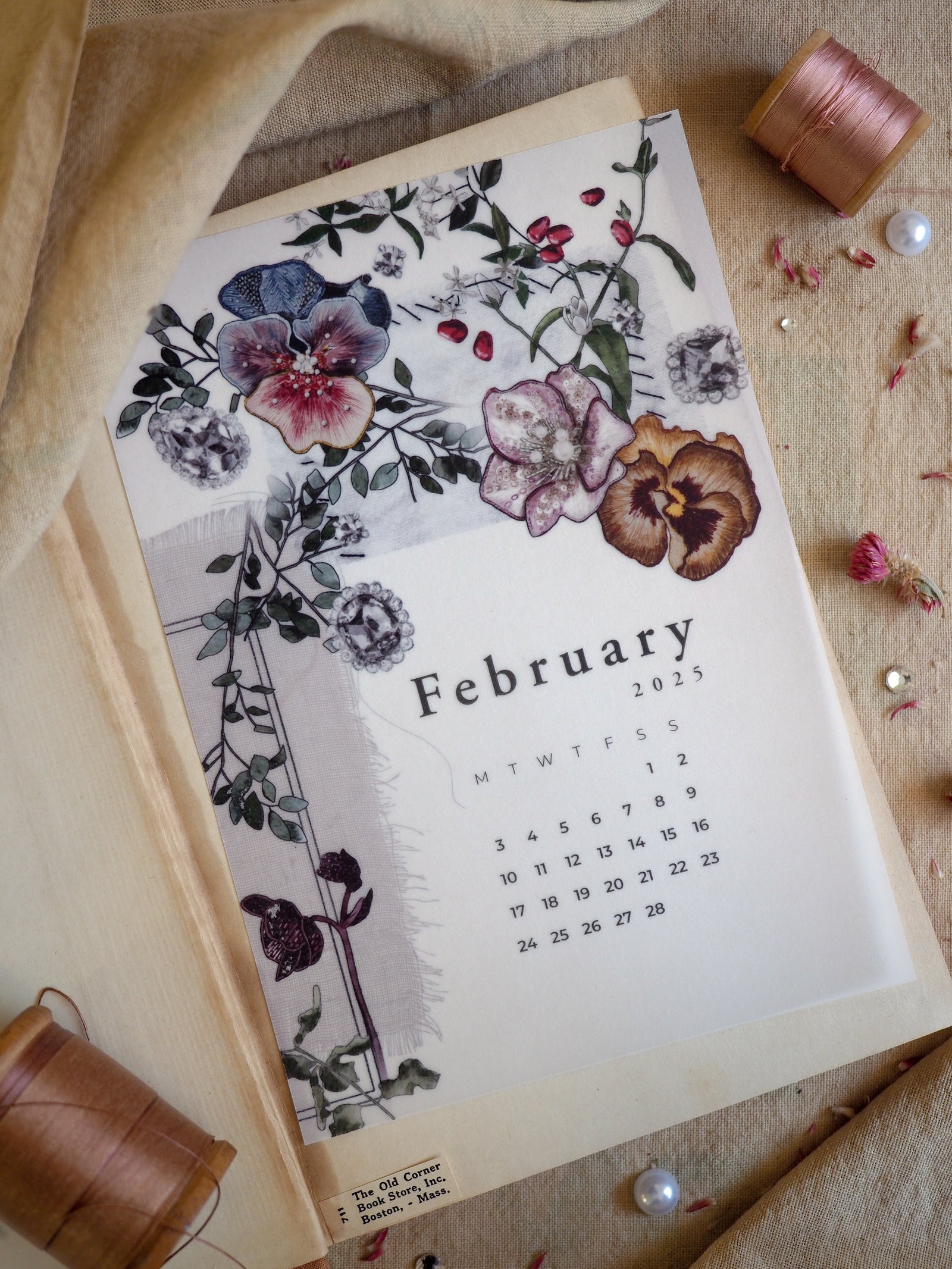 Beautifully designed B6 monthly calendar for February 2025, featuring intricate watercolor florals in shades of lavender, plum, and deep rose surrounding the calendar grid.