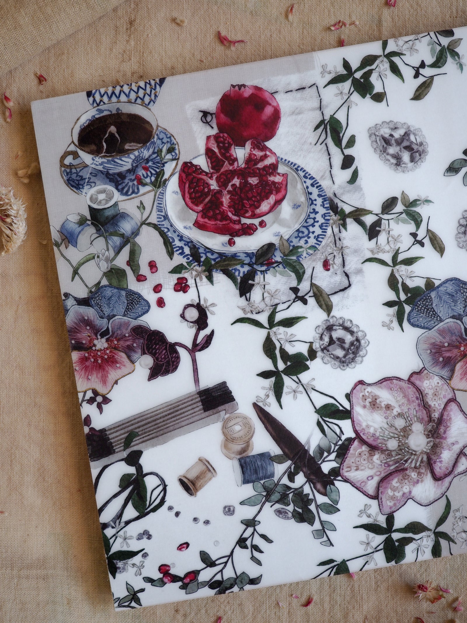 Vellum paper for February 2025 adorned with a rich botanical pattern of red berries, teacups, and detailed watercolor floral illustrations.