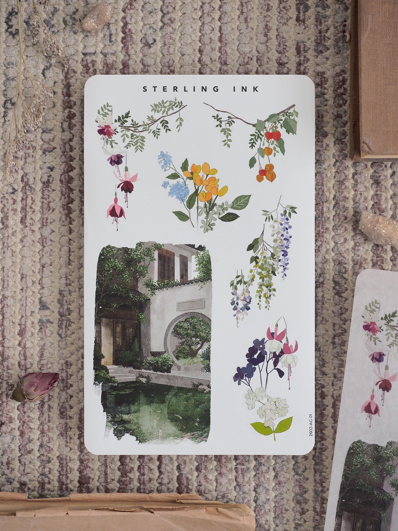 Botanical sticker sheet for February 2026 featuring a colorful arrangement of painted flowers, berries, and foliage in watercolor style.