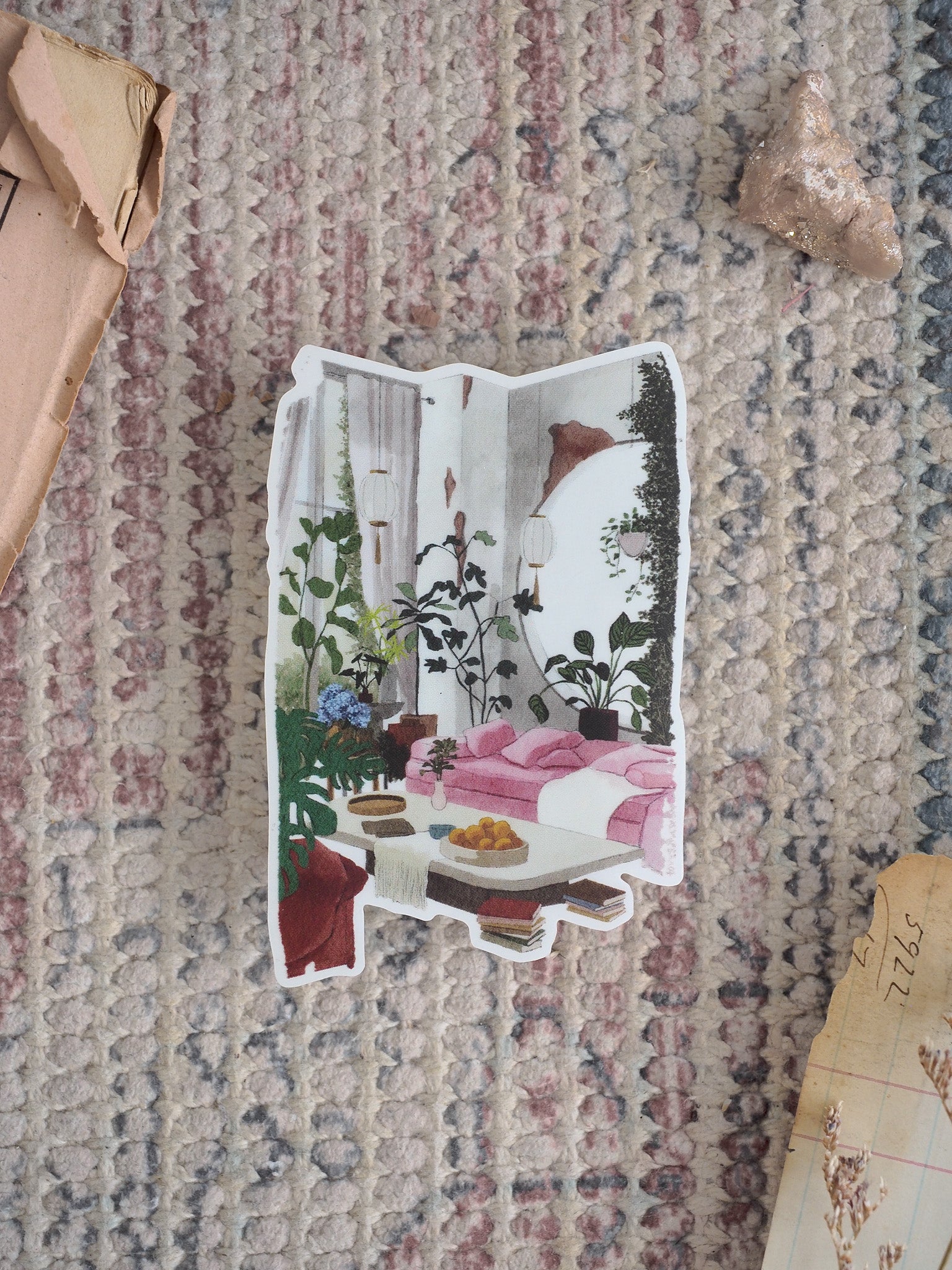 Charming die-cut sticker of a cozy "Rosy Corner" interior scene featuring lush houseplants, a sunlit windowsill, and a delightful breakfast nook.