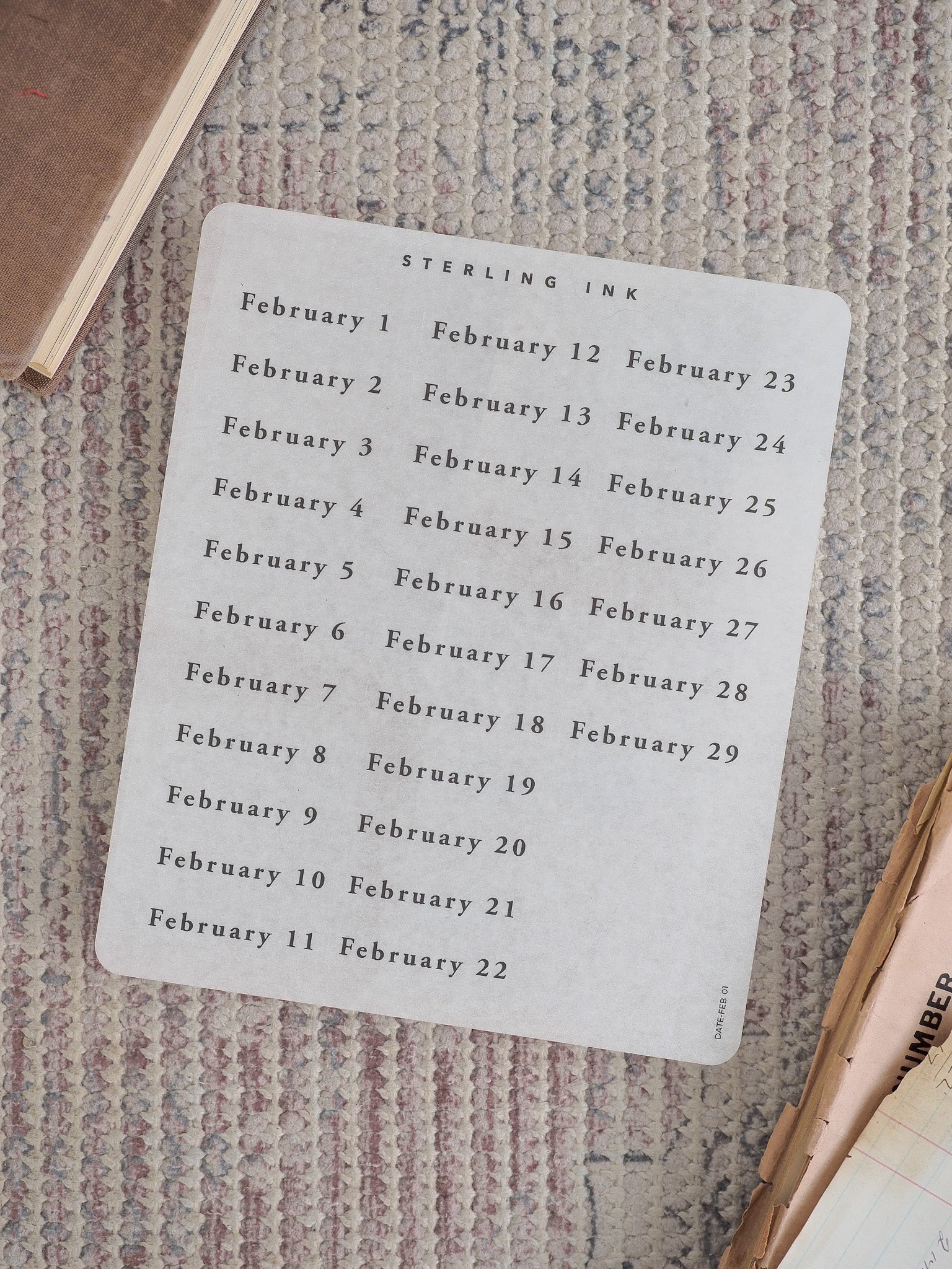 White calendar sticker sheet detailing every date for February 2026, arranged in two clean columns using crisp black typography.