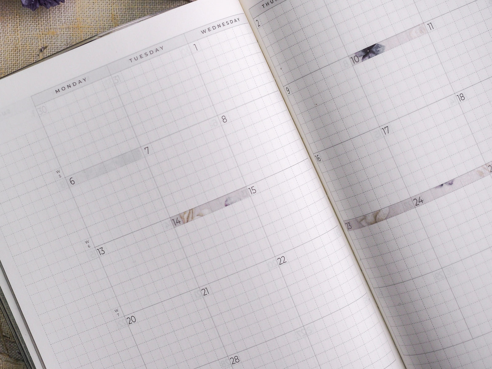 Elegant thin strip stickers with a sophisticated white and gray marble pattern, perfectly designed to mark dates across a February 2024 planner.