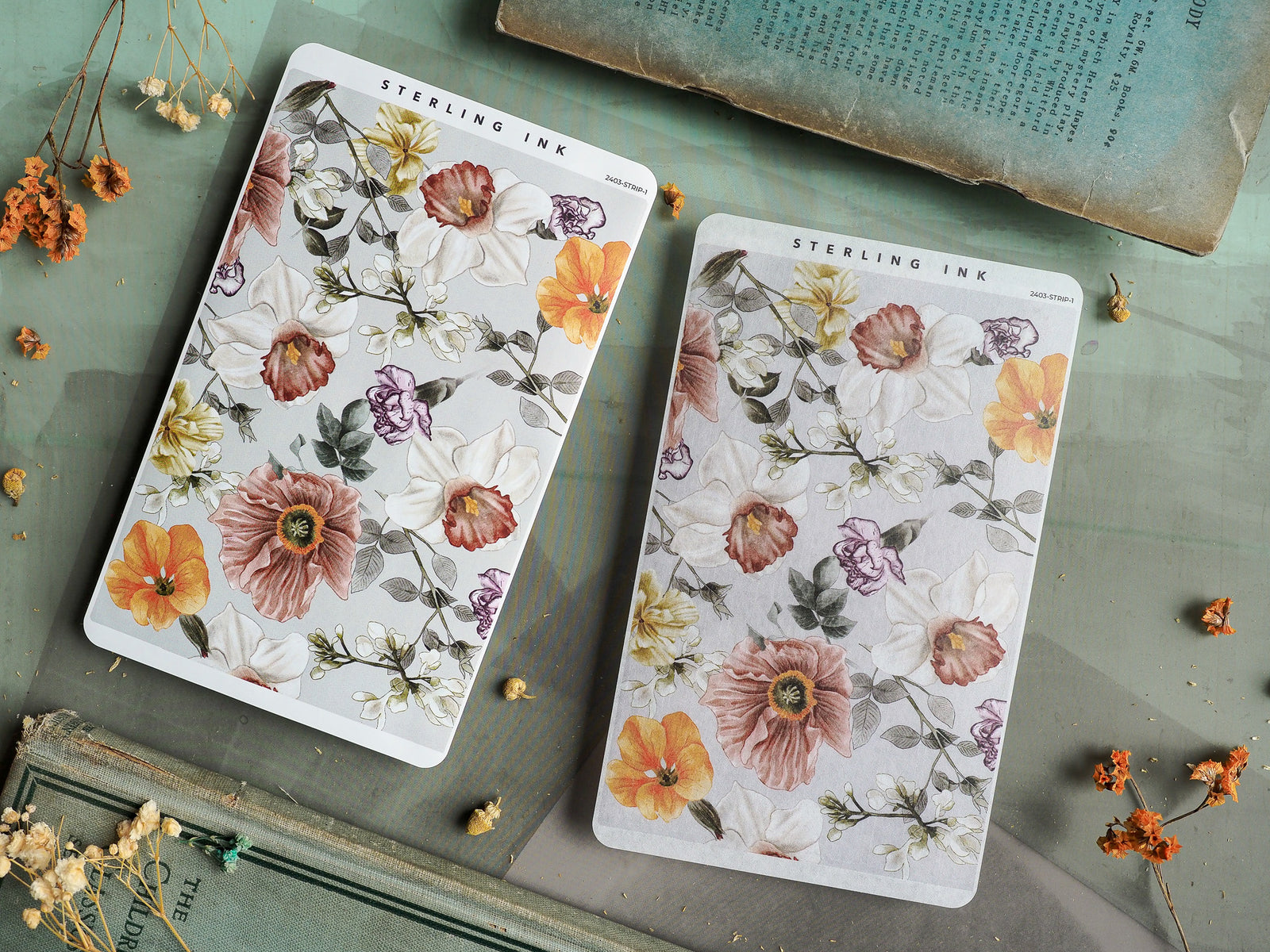 Intricate floral sticker sheets featuring a delicate watercolor pattern of blooms in soft blush, warm orange, and creamy pink tones.