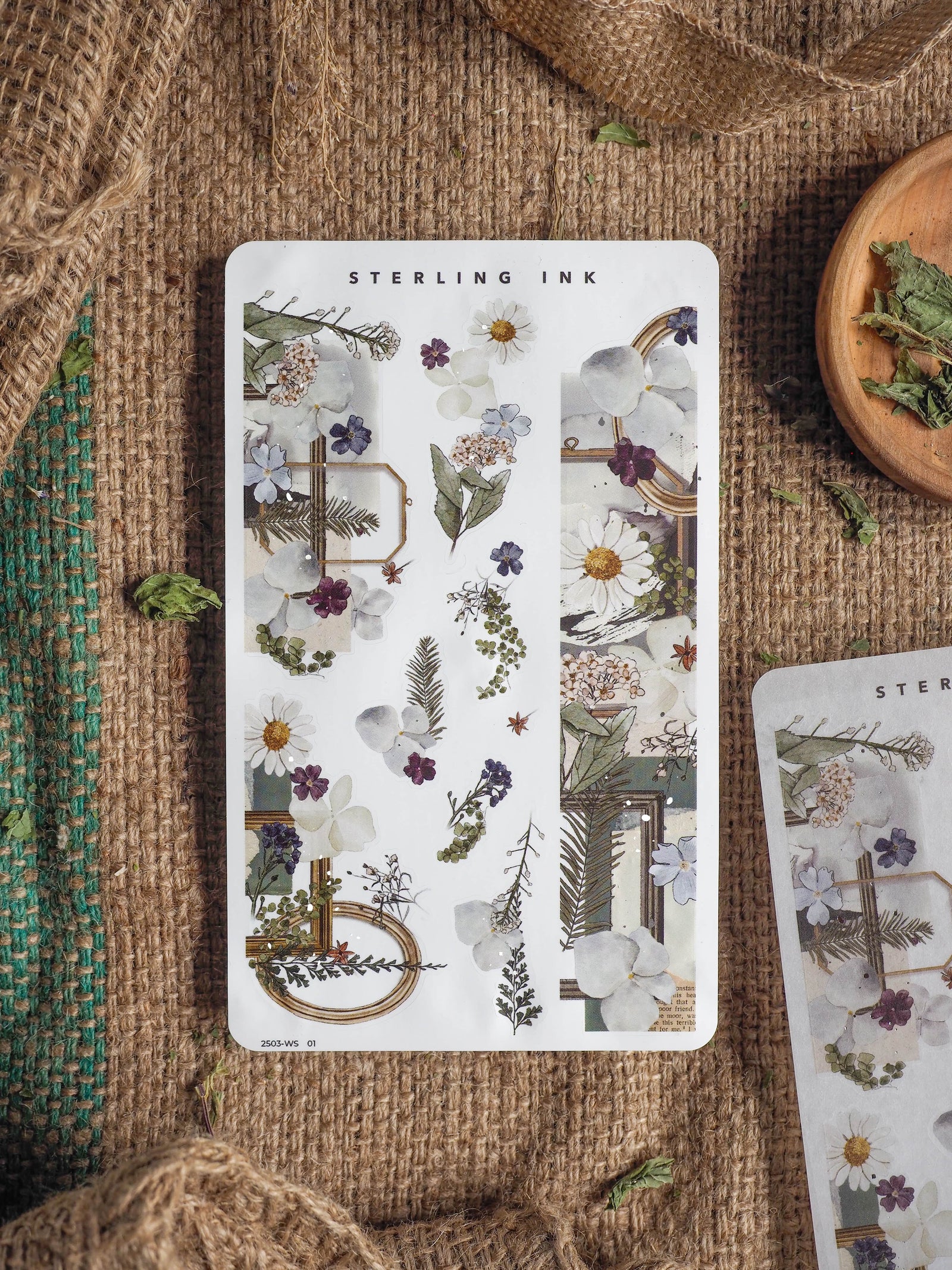 Delicate botanical washi strip sticker set featuring muted wildflowers, lush greens, and ornate silver foil frames for planners, scrapbooking, and journaling.