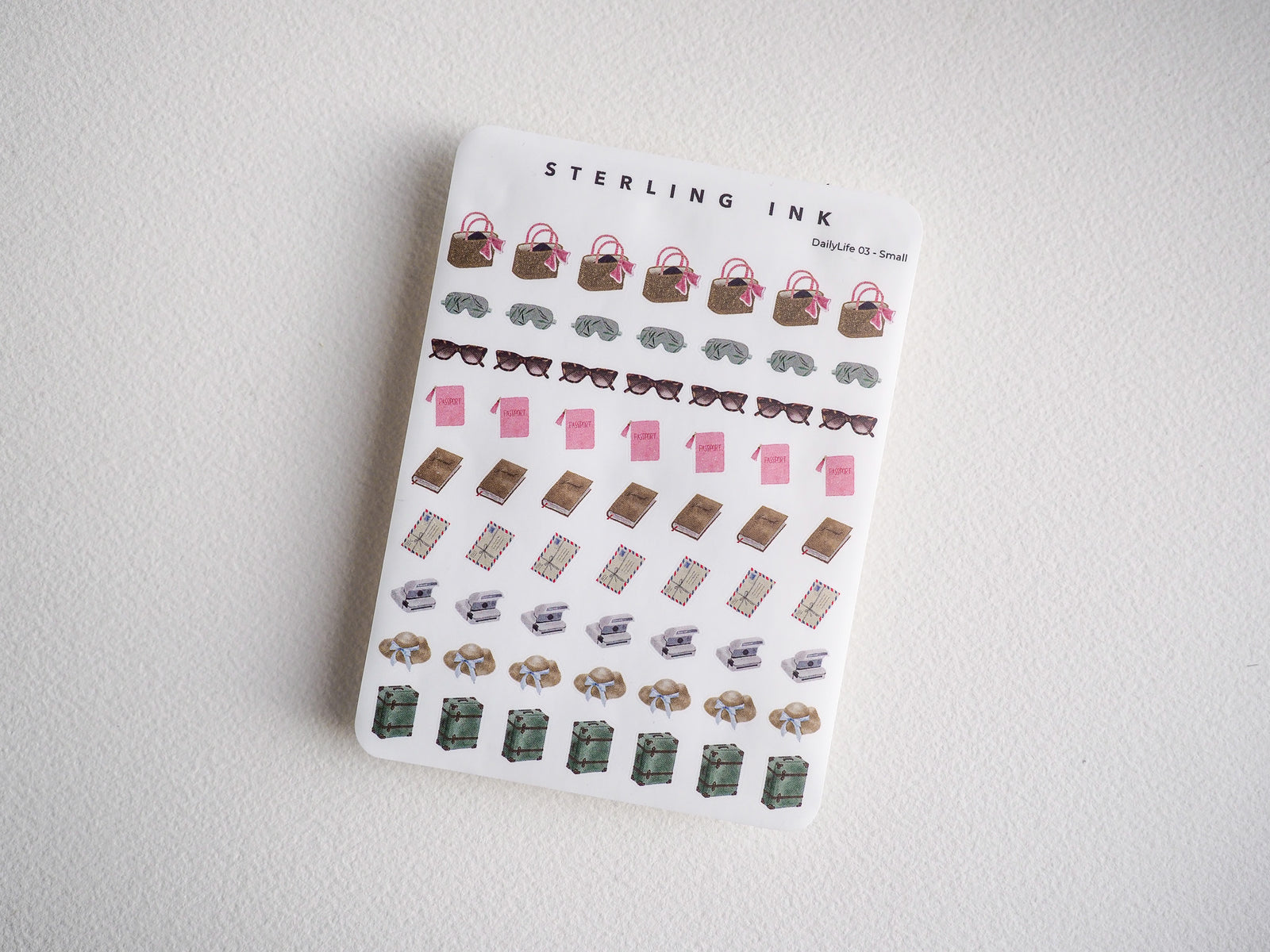 Cute daily life sticker set featuring tiny mini purses, sunglasses, books, boxes, and stacked packages. Perfect for