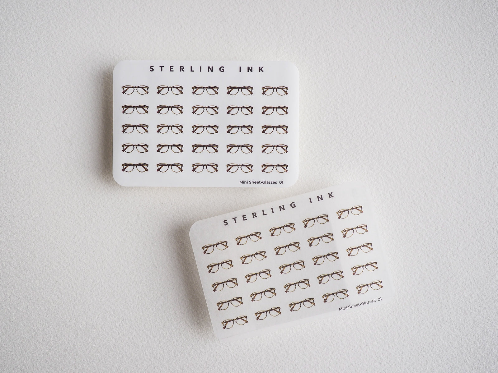 Set of mini glasses sticker sheets. Minimalist line-art design featuring dozens of detailed eyeglass and sunglass