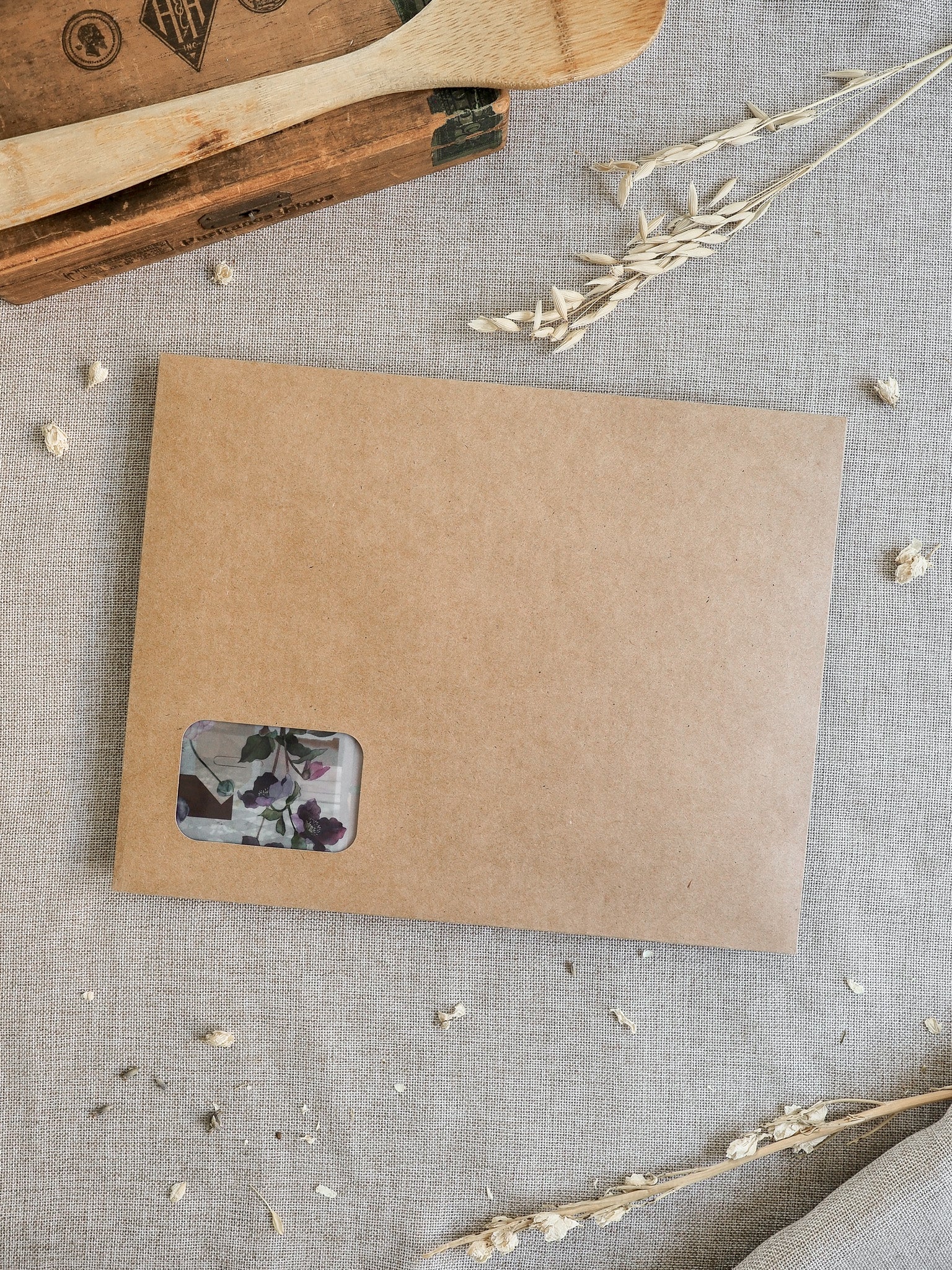 Kraft brown cardstock packaging featuring a decorative floral window, suitable for the March 2026 limited edition subscription kit.
