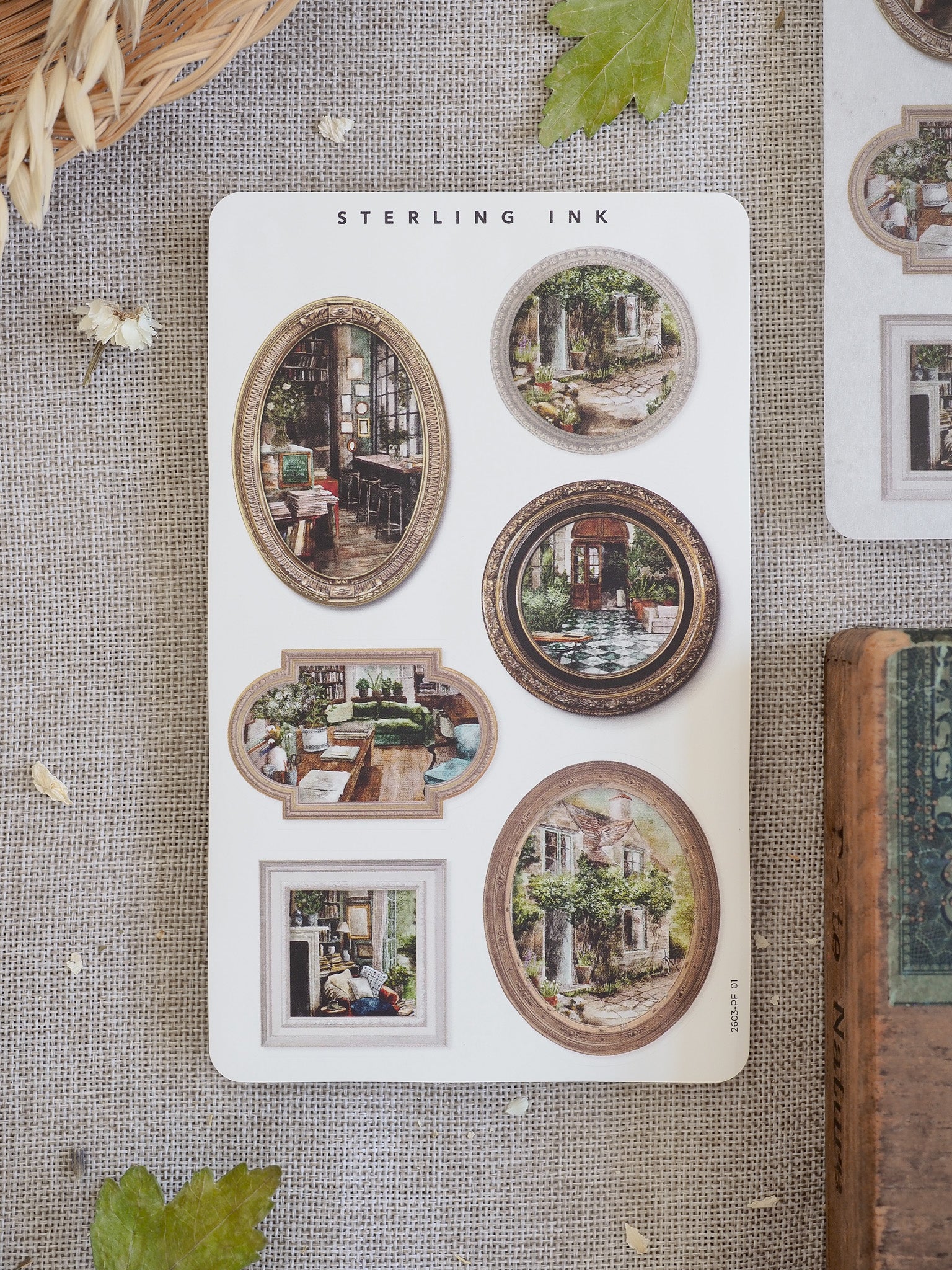 Vintage sepia-toned sticker set featuring various picture frame designs showcasing detailed illustrations of gardens, historical buildings, and classic interiors.