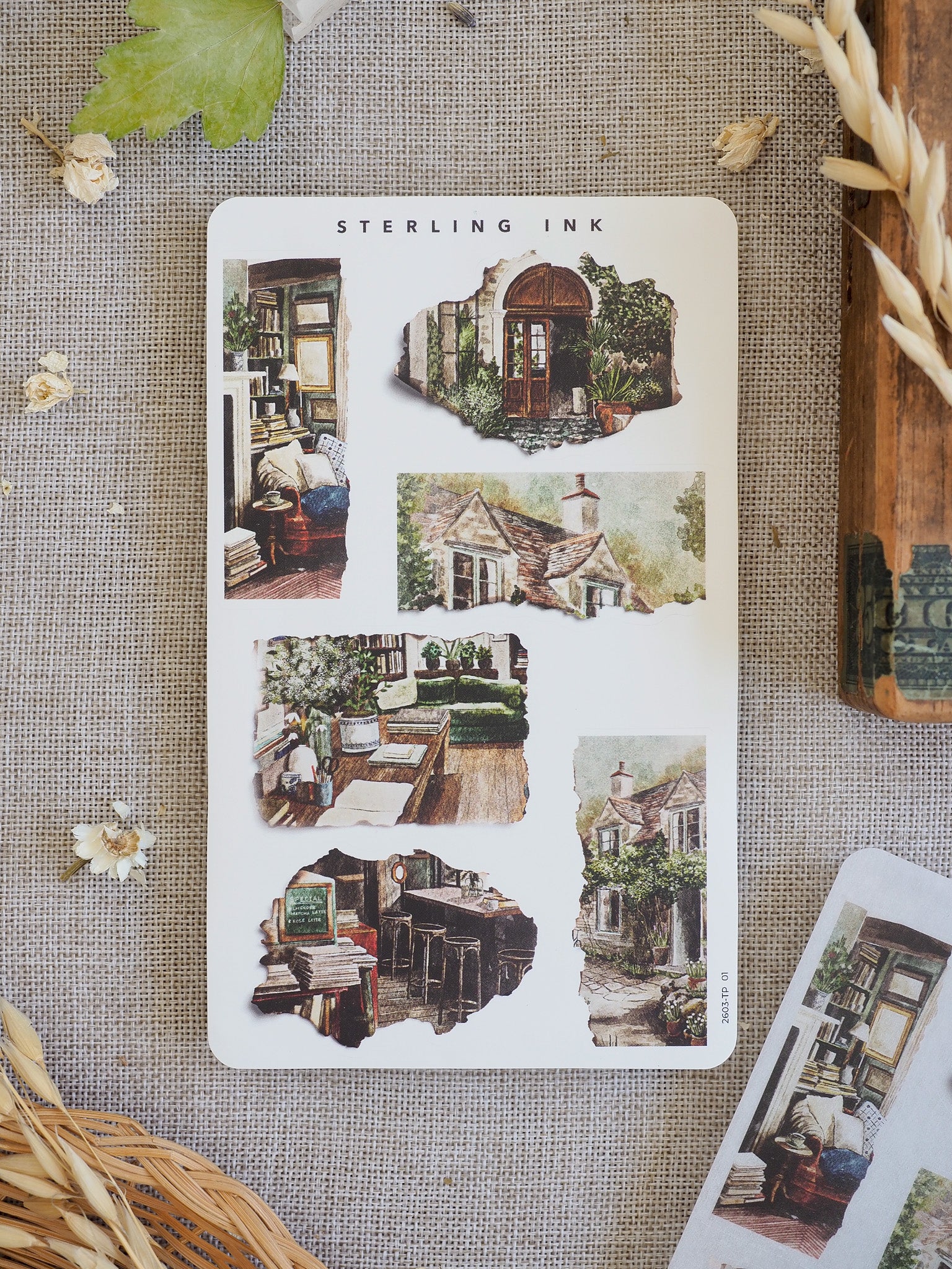 Sheet of vintage torn paper stickers featuring rustic illustrations of cottages, antique bookshelves, and detailed architectural sketches.