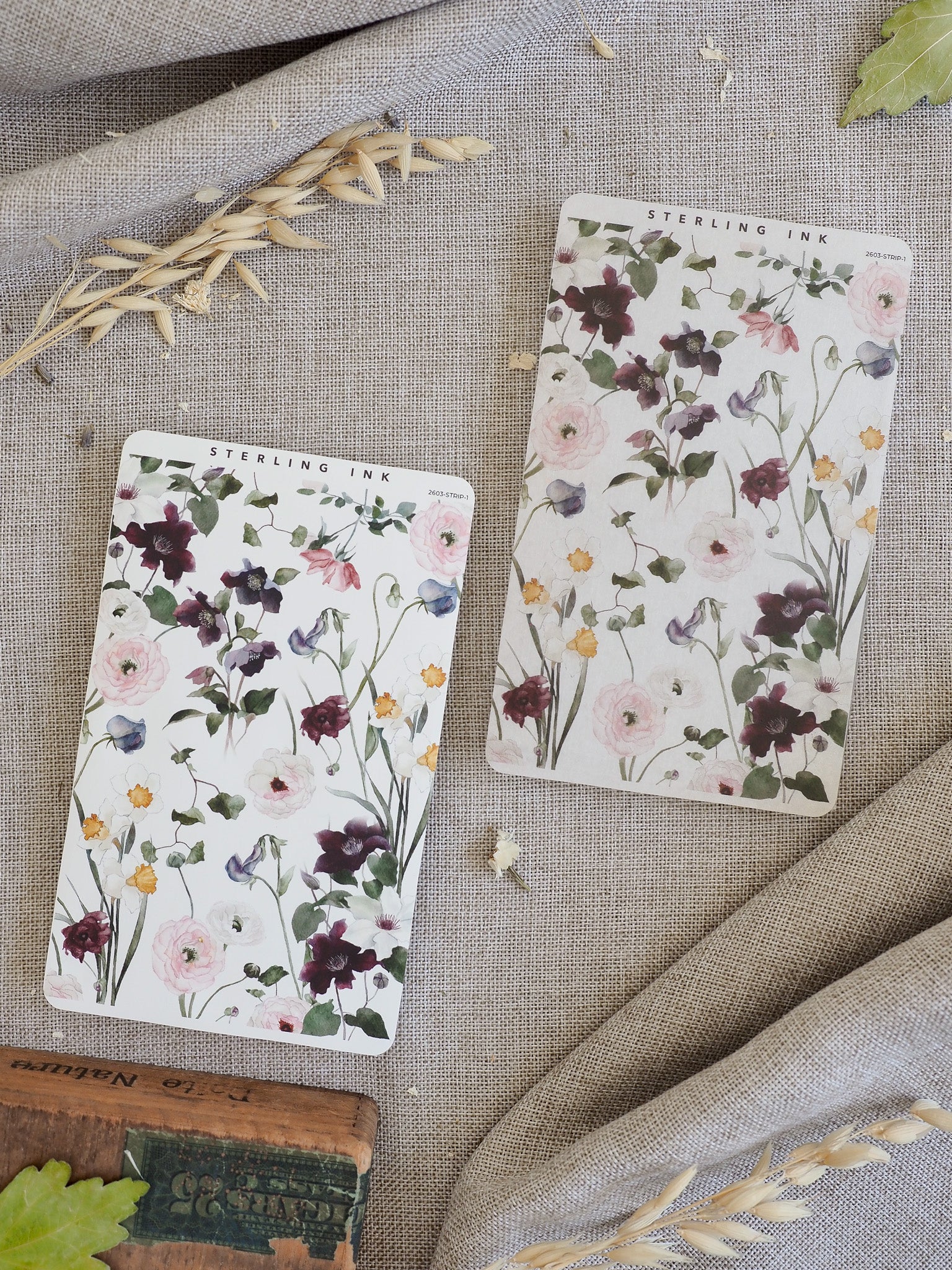 Elegant floral stickers patterned with watercolor washes of blush pink, mauve, and plum blossoms, perfect for journaling or scrapbooking.