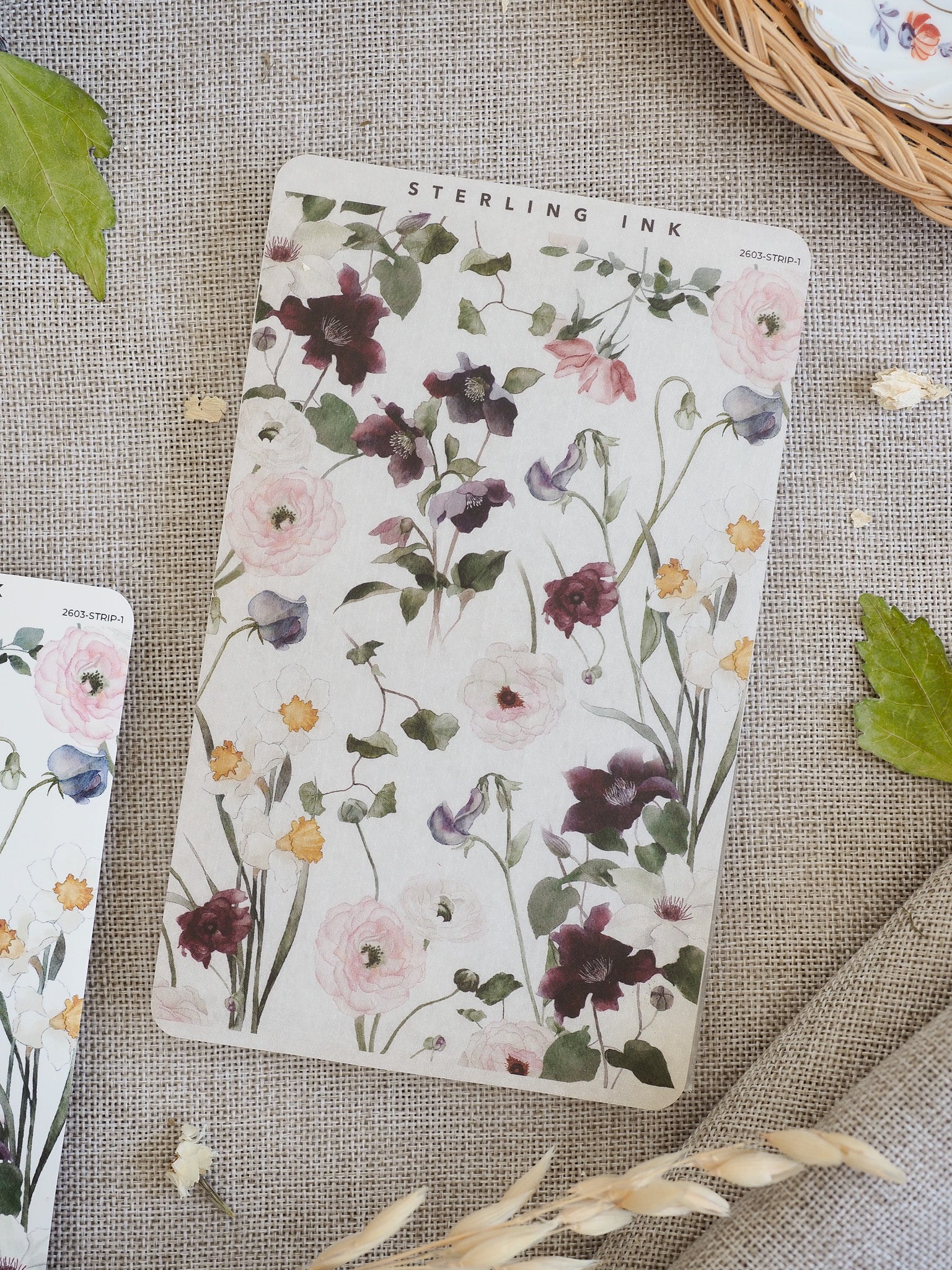Elegant sticker strip featuring a delicate watercolor bouquet pattern of blush pink, mauve, and deep purple spring flowers.