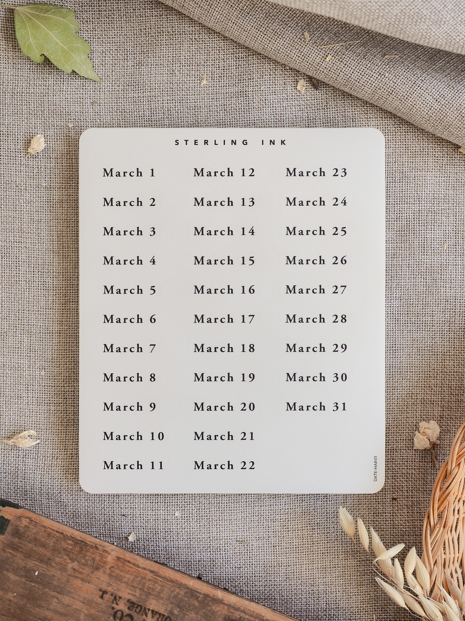 Crisp white sticker sheet featuring a clean calendar grid with all the dates for March 2026, designed for journaling and planning.