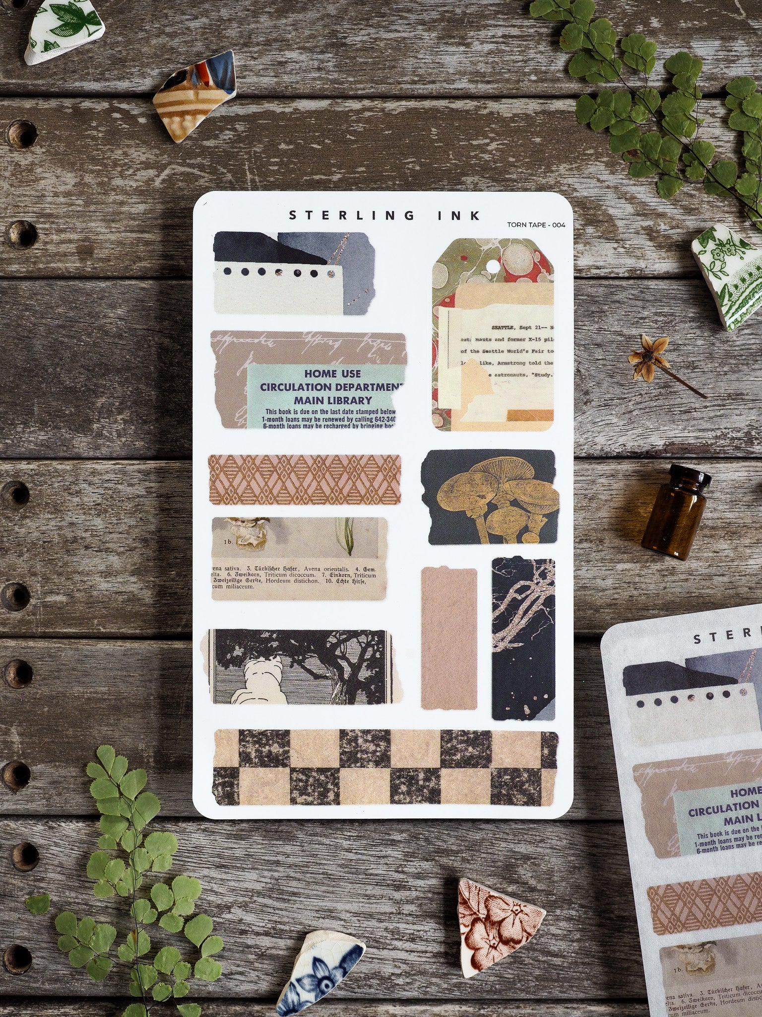 Sterling Ink Torn Tape stickers featuring a variety of decorative designs, including checkered patterns, stripes, and delicate anatomical bone motifs, ideal for journaling and crafting.