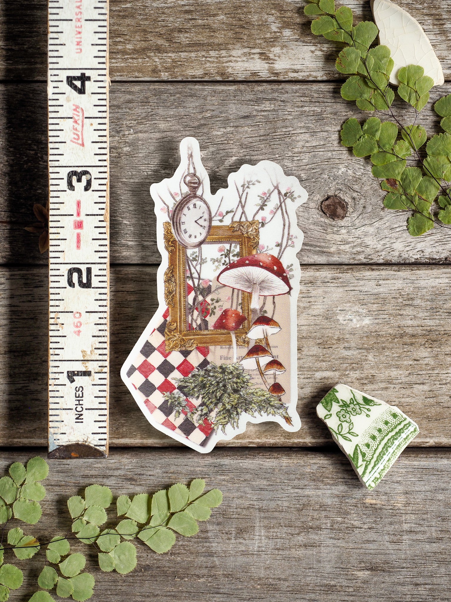 Whimsical vinyl sticker featuring a vintage collage of detailed mushrooms, delicate florals, and an antique clock set against a checkered pattern, celebrating spring nature.
