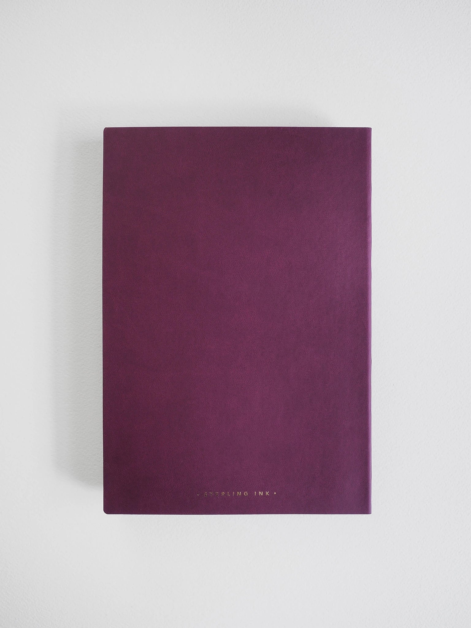A dark purple notebook with a textured cover and gold foil text at the bottom, displayed on a clean white background.
#Color_Mulberry