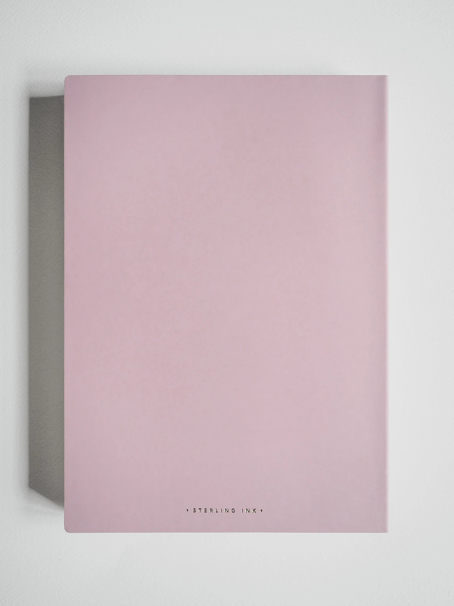 A minimalist pink notebook with a matte finish, featuring the brand name 'STERLING INK' in small black text at the bottom center, displayed against a clean white background.
#Color_Fairyfloss