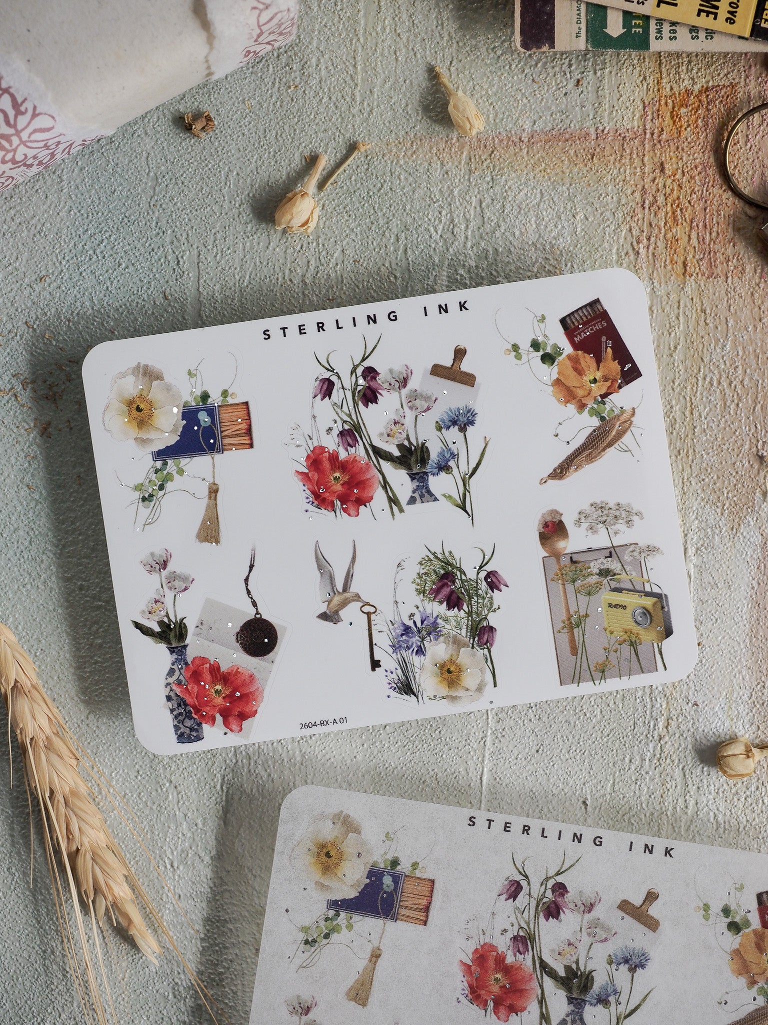 Decorative sheet of edges and corners stickers featuring vibrant watercolor florals, botanical sketches, and elegant silver foil accents perfect for scrapbooking and planning.