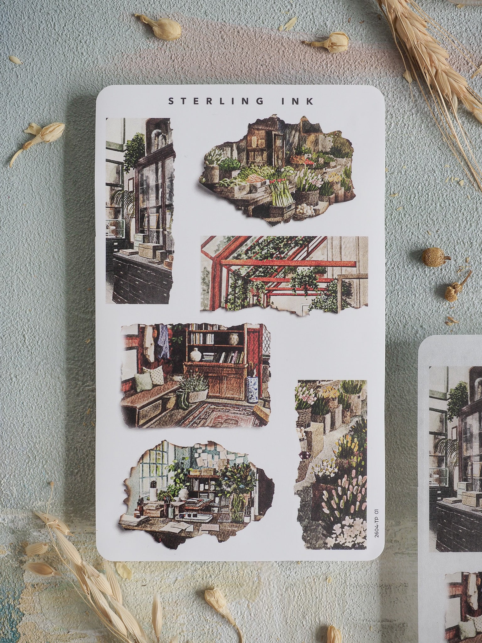 Sheet of "Torn Paper Stickers - April 2026" featuring a nostalgic collage of highly detailed, sepia-toned architectural street scenes.