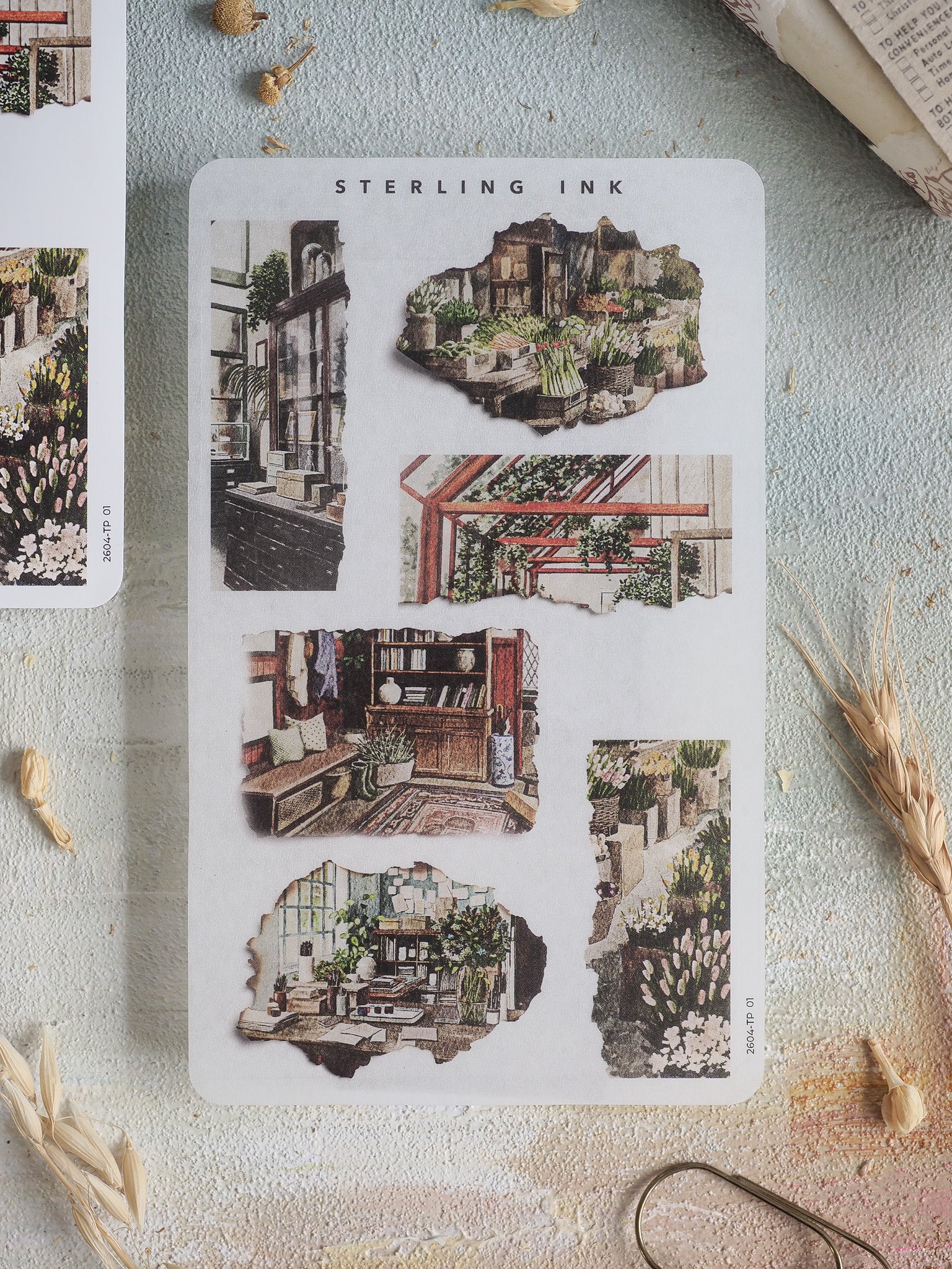 Sheet of vintage-style torn stickers showcasing detailed illustrations of lush architecture, interior shop scenes, and botanical clippings.