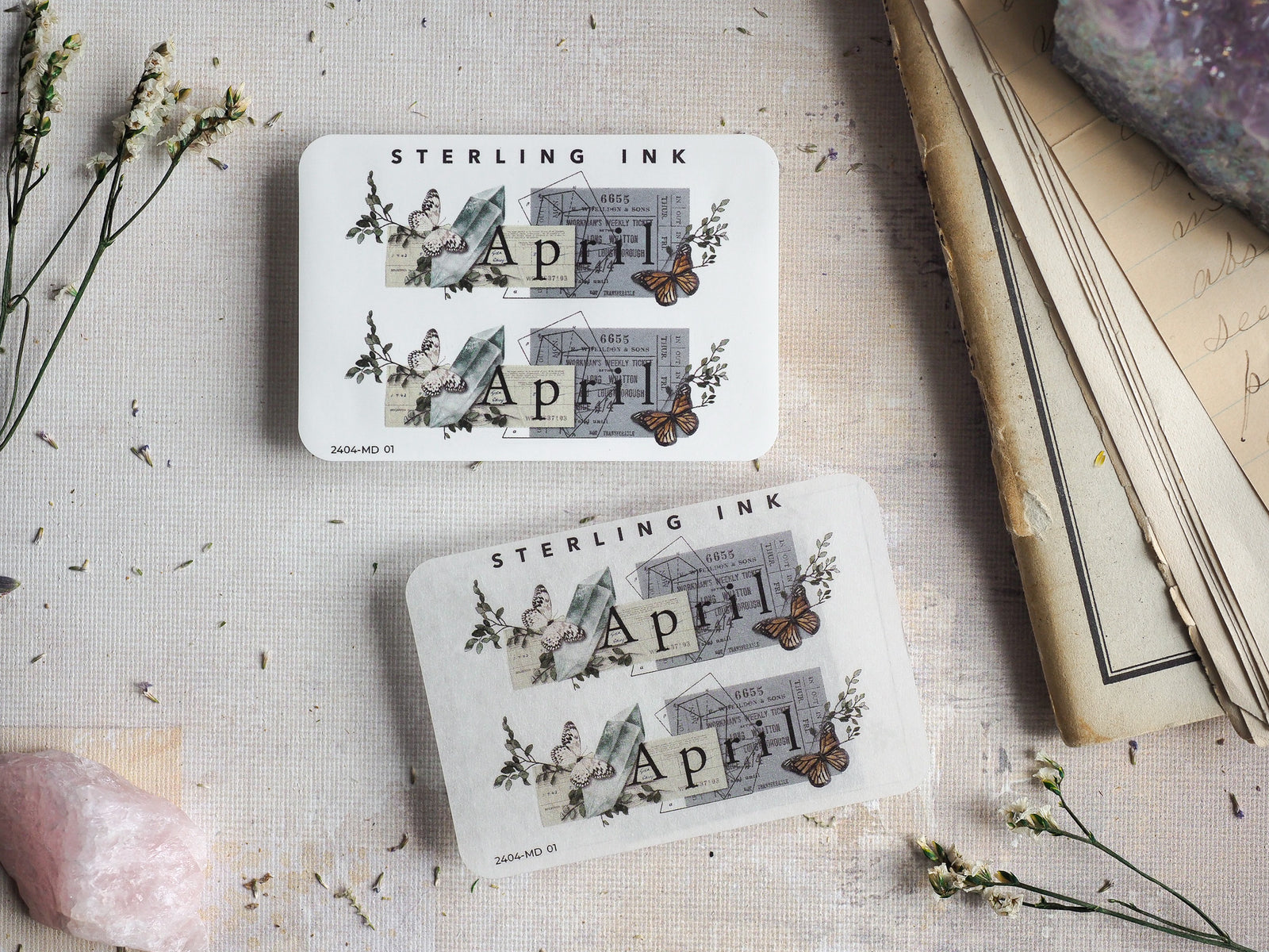 Vintage April month stickers featuring elegant butterfly illustrations, subtle architectural motifs, and spring floral details.