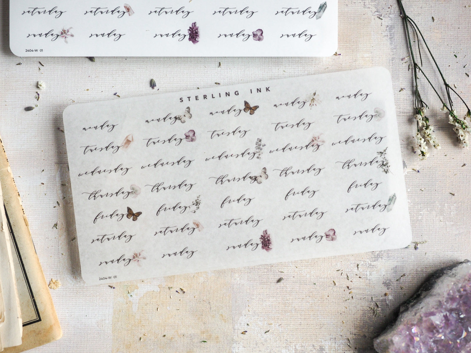 Decorative sticker sheets for planning, featuring whimsical weekday labels for April 2024 adorned with delicate butterfly and floral accents.