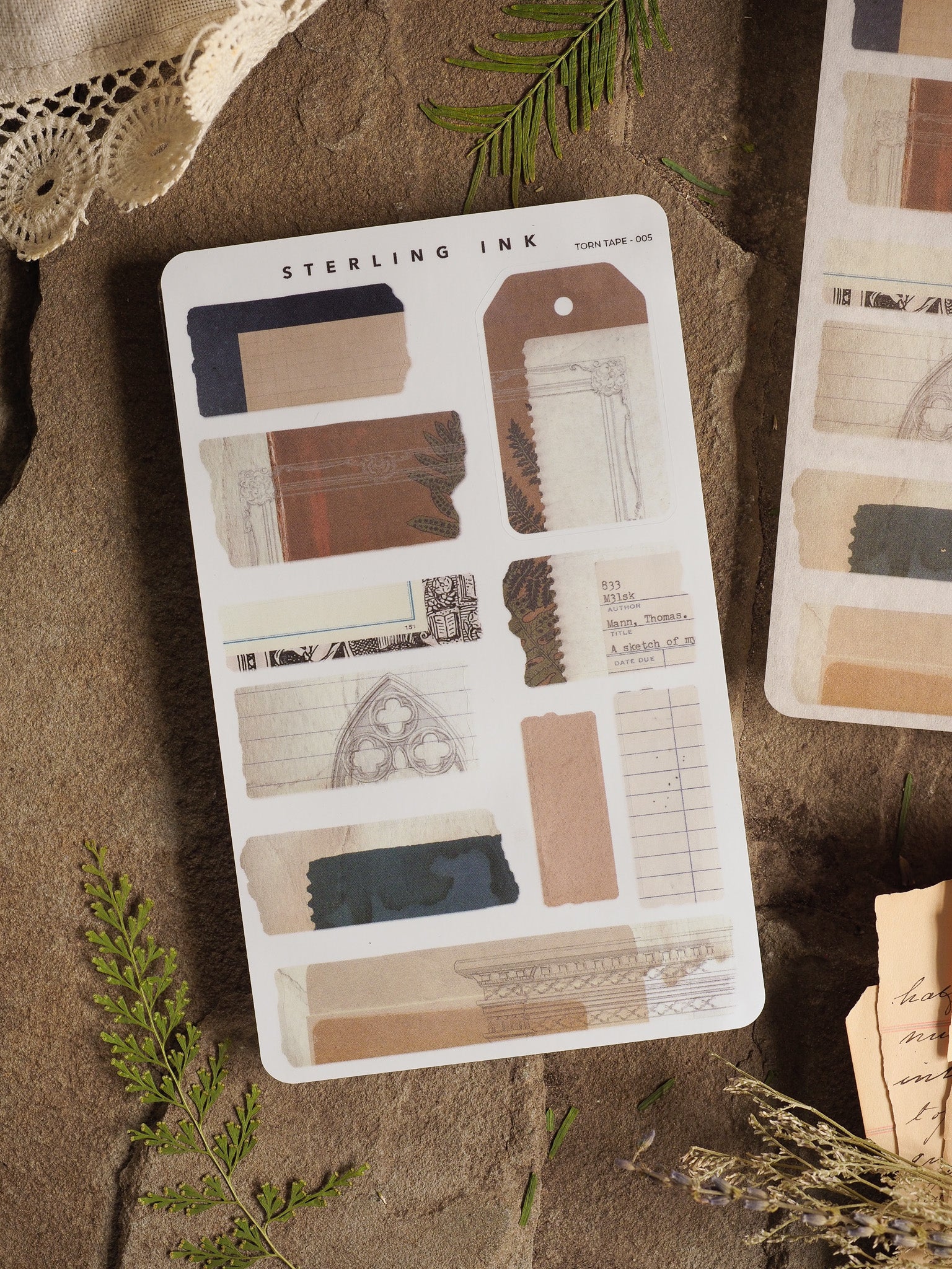 Assortment of distressed torn tape stickers in varying shades of brown, blue, and cream, perfect for journaling with classical and rustic patterned paper strips.