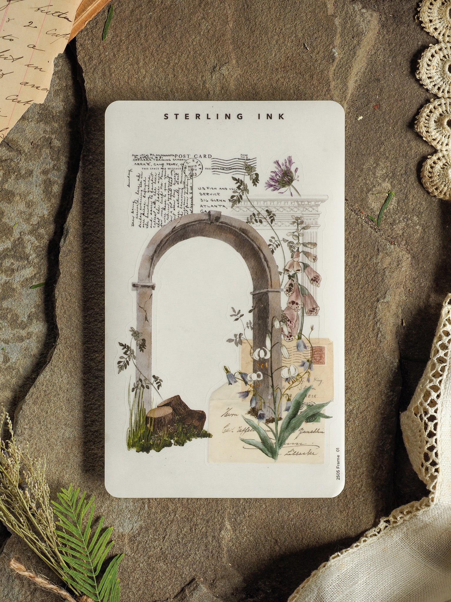 Vintage botanical frame sticker, featuring an elegant arched border and detailed watercolor illustrations of various flowering plants, titled 'Sterling Ink.'