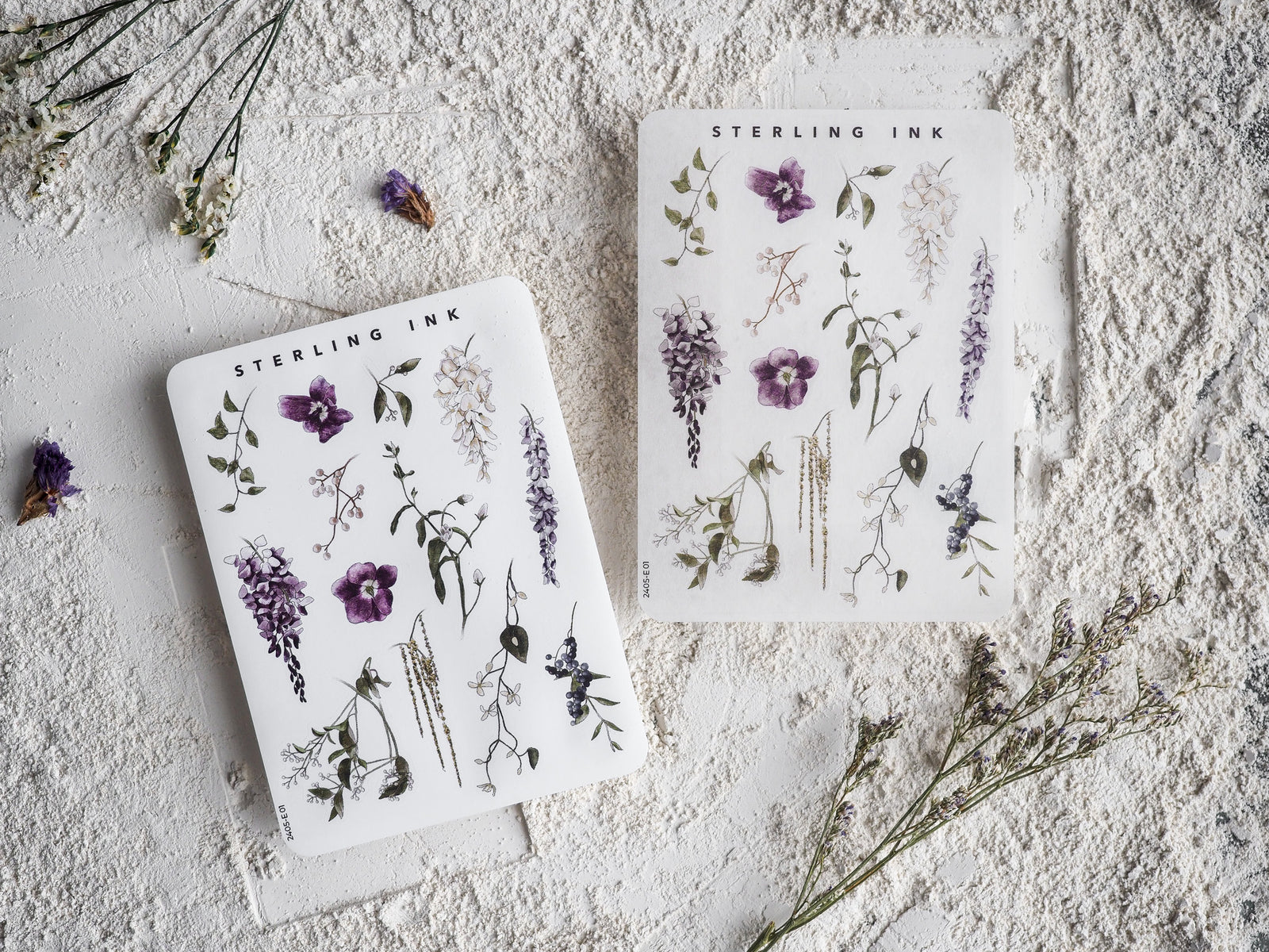 Detailed botanical sticker sheet featuring various sketches of purple and pink flowers, delicate stems, and natural meadow elements.