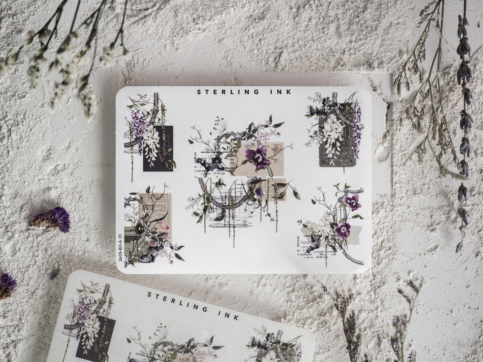 Archival stationery stickers featuring an intricate botanical design, combining purple floral clusters, delicate scientific diagrams, and decorative corner accents.