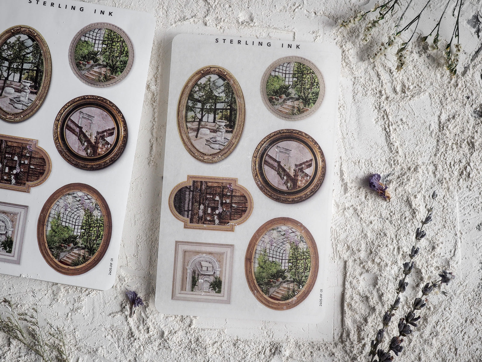 Sheet of assorted vintage picture frame stickers featuring distressed gold and brown borders surrounding antique architectural scenes like greenhouses and old city passages.