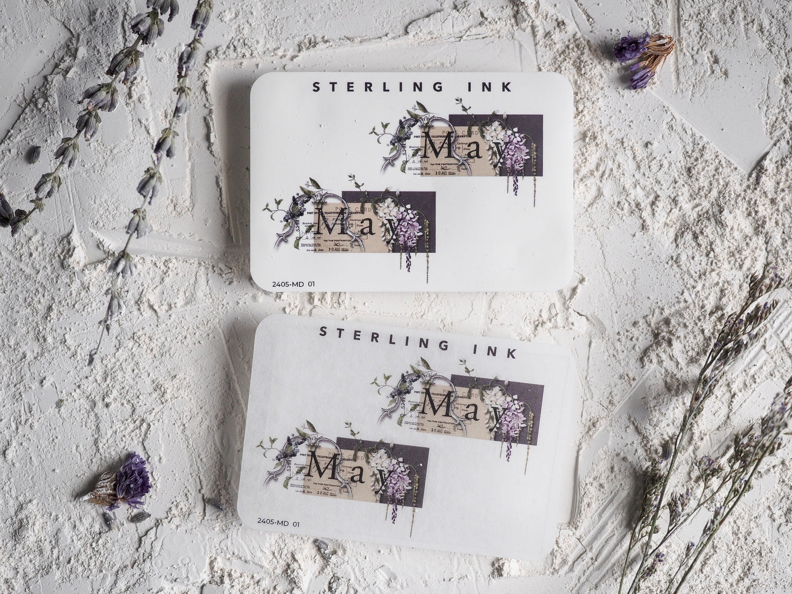 Decorative May month sticker sheet displaying watercolor florals, purple and pink blooms, and "Sterling Ink" lettering.